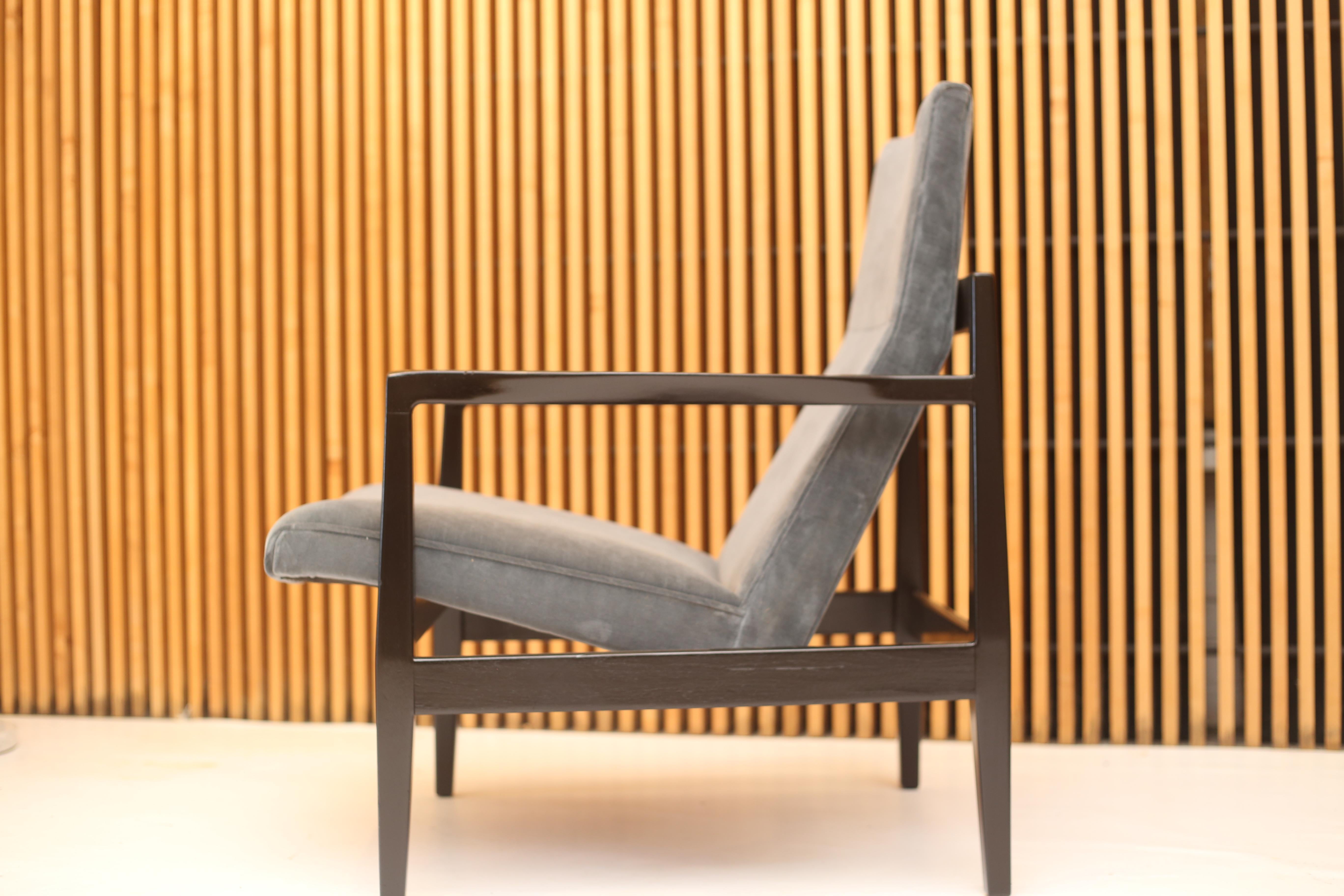 Pair of Jens Risom floating lounge chairs. 

Frames are black lacquered walnut with a satin finish and have new foam and blue cotton velvet upholstery. 

Dimensions:
Width 27