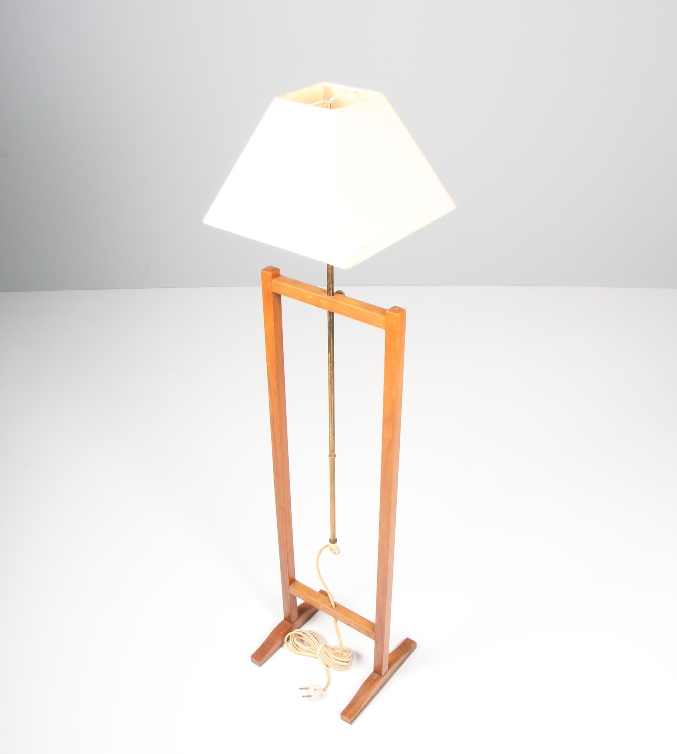 Floor lamp in walnut and brass, model 2548. Designed by Josef Frank for Firma Svenskt Tenn, Sweden, 1952.

 