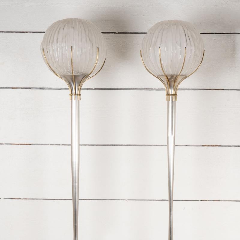 Pair of chrome and gold-plated brass floor lamps, large glass ball, completely restored.
Designer Angelo Brotto for Esperia.
Italy around 1960.

Height 180 cm