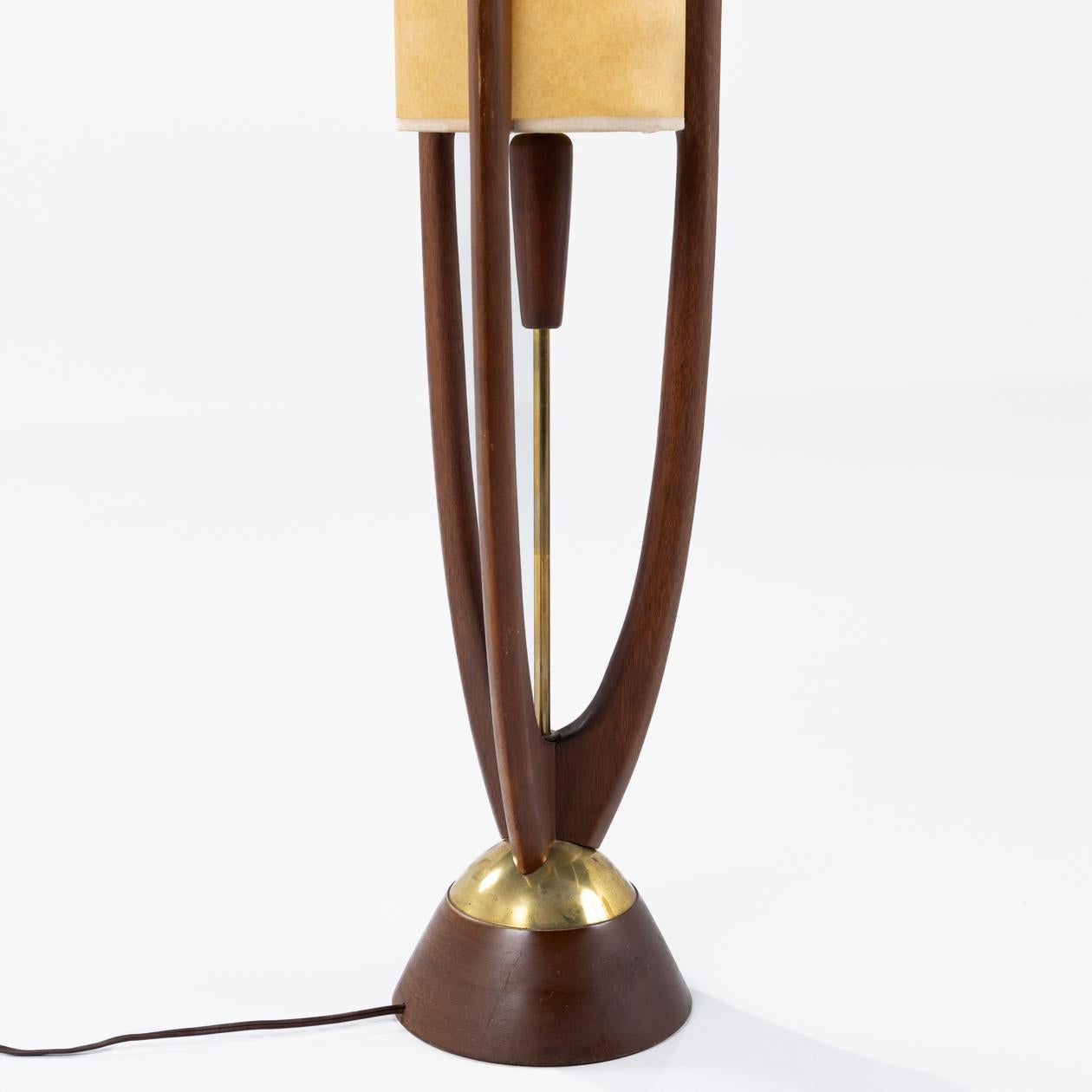 A pair of floor lamps in walnut and brass. John Keal / Modeline