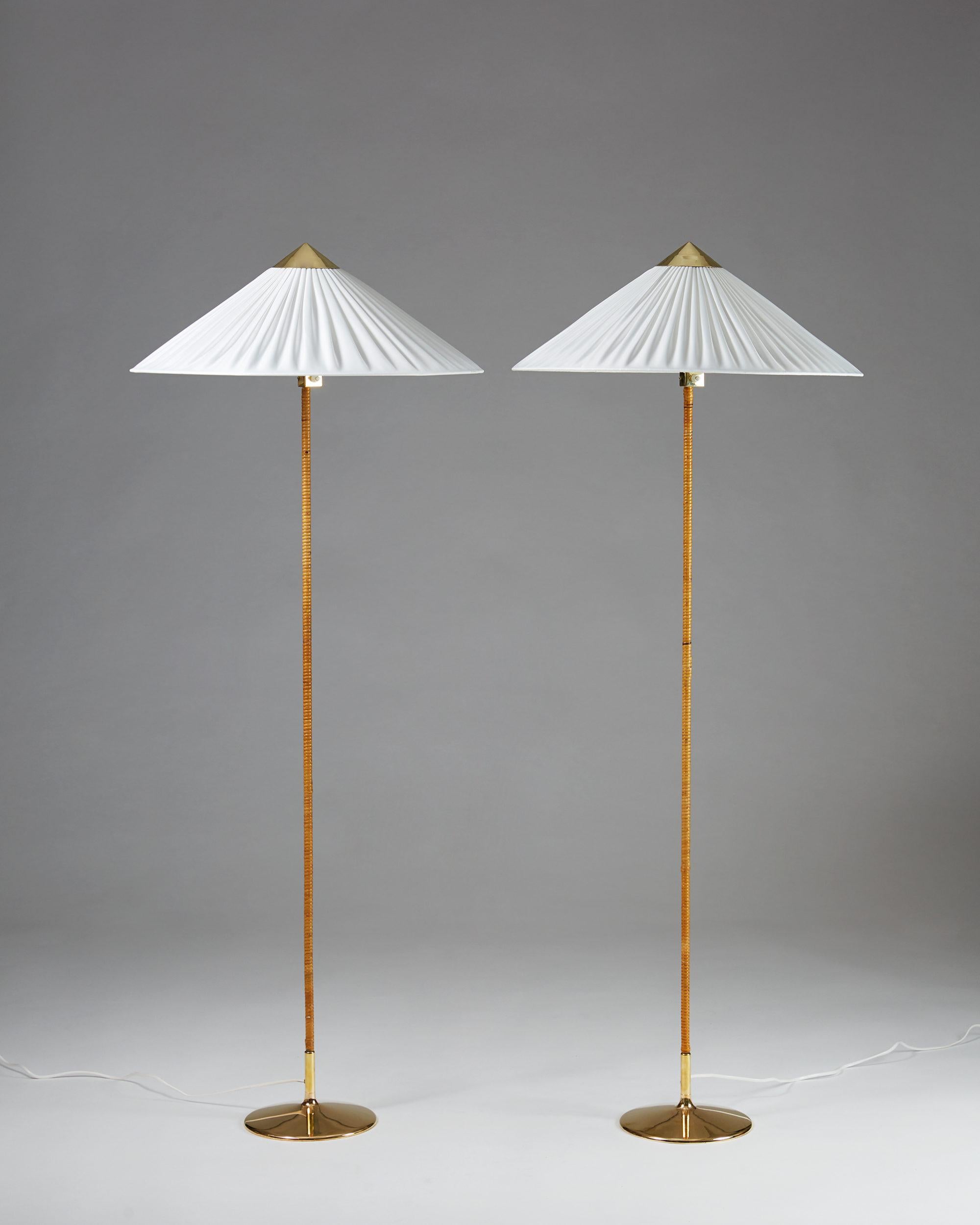 Brass, cane and fabric shades.

Measures: H 160 cm/ 5' 3 1/4