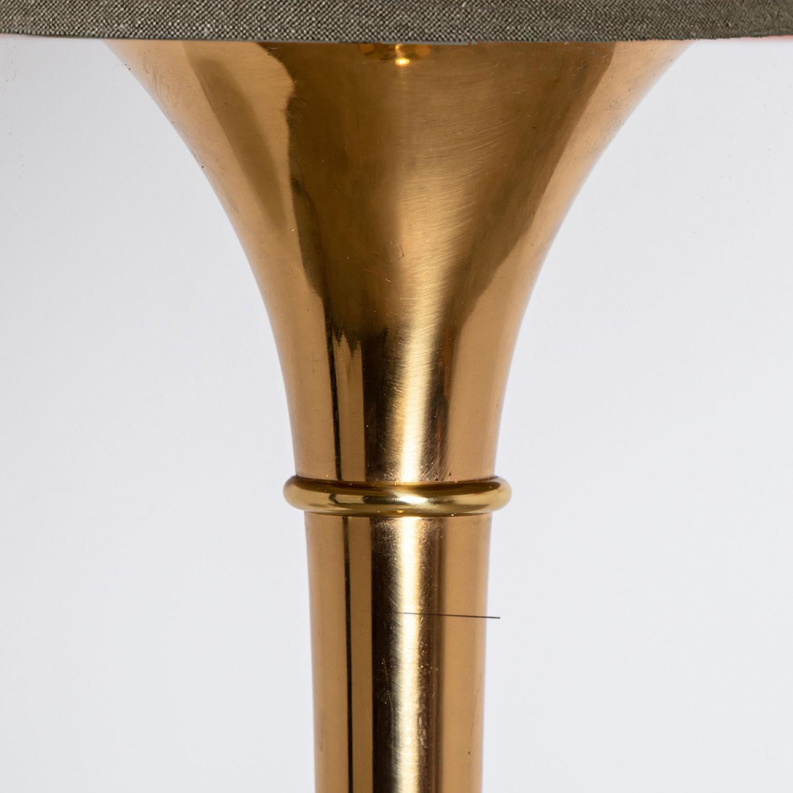 Pair of elegant gold brass wooden floor lamps Model designed by Ingo Maurer, 1968 for Design M Munich, Germany.
With new wood custom made lamp shades with Bronze inner shade. Made by Rene Houben. Also other lampshades available. Ask for additional