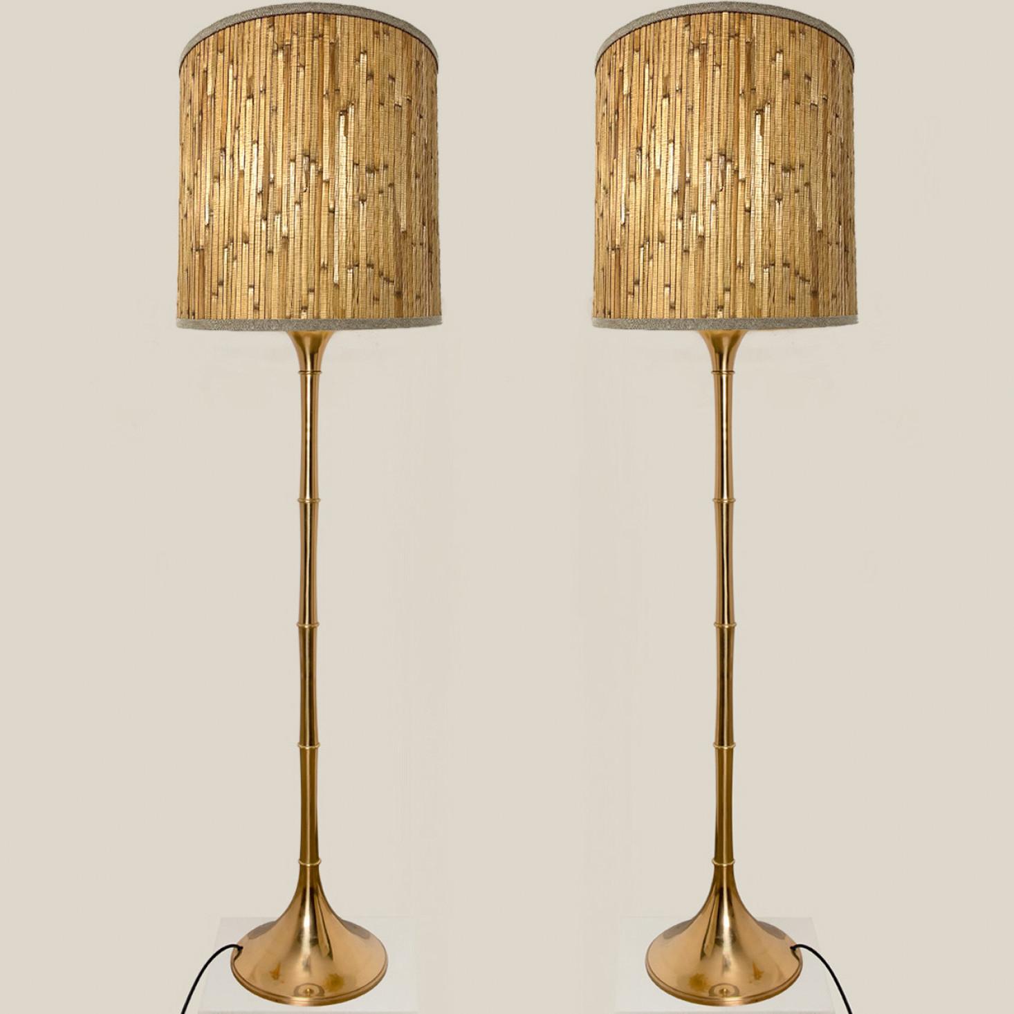 Pair of elegant gold brass wooden floor lamps Model designed by Ingo Maurer, 1968 for Design M Munich, Germany.
With new wood custom made lamp shades with Bronze inner shade. Made by Rene Houben. Also other lampshades available. Ask for additional