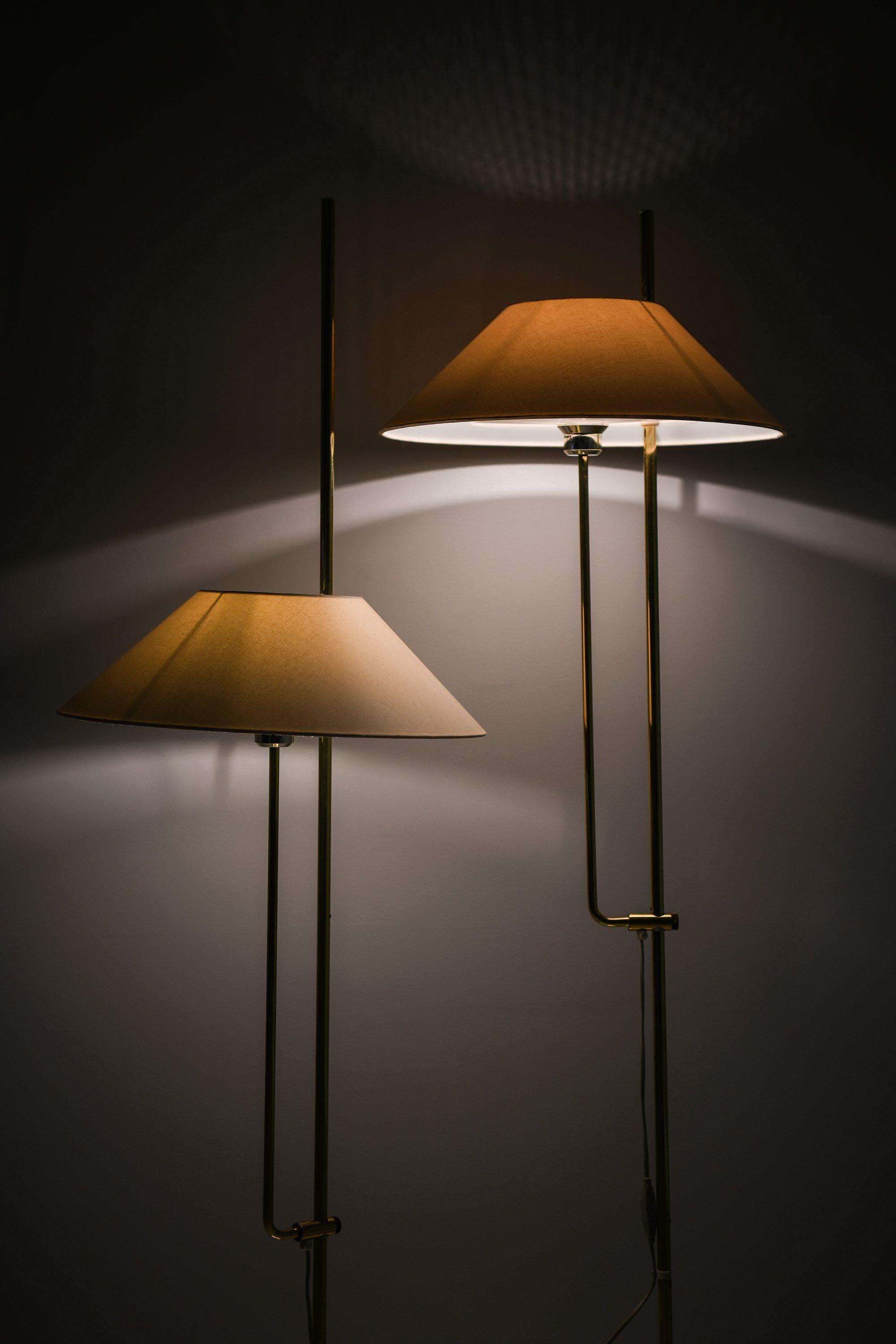 Pair of Floor Lamps in Brass and Original Lamp Shades, 1970's

Additional Information:
Material: Brass and original lamp shades
Style: Mid century, Scandinavian
Rare pair of floor lamps model G 122
Produced by Bergboms in Sweden
Dimensions (W x D x