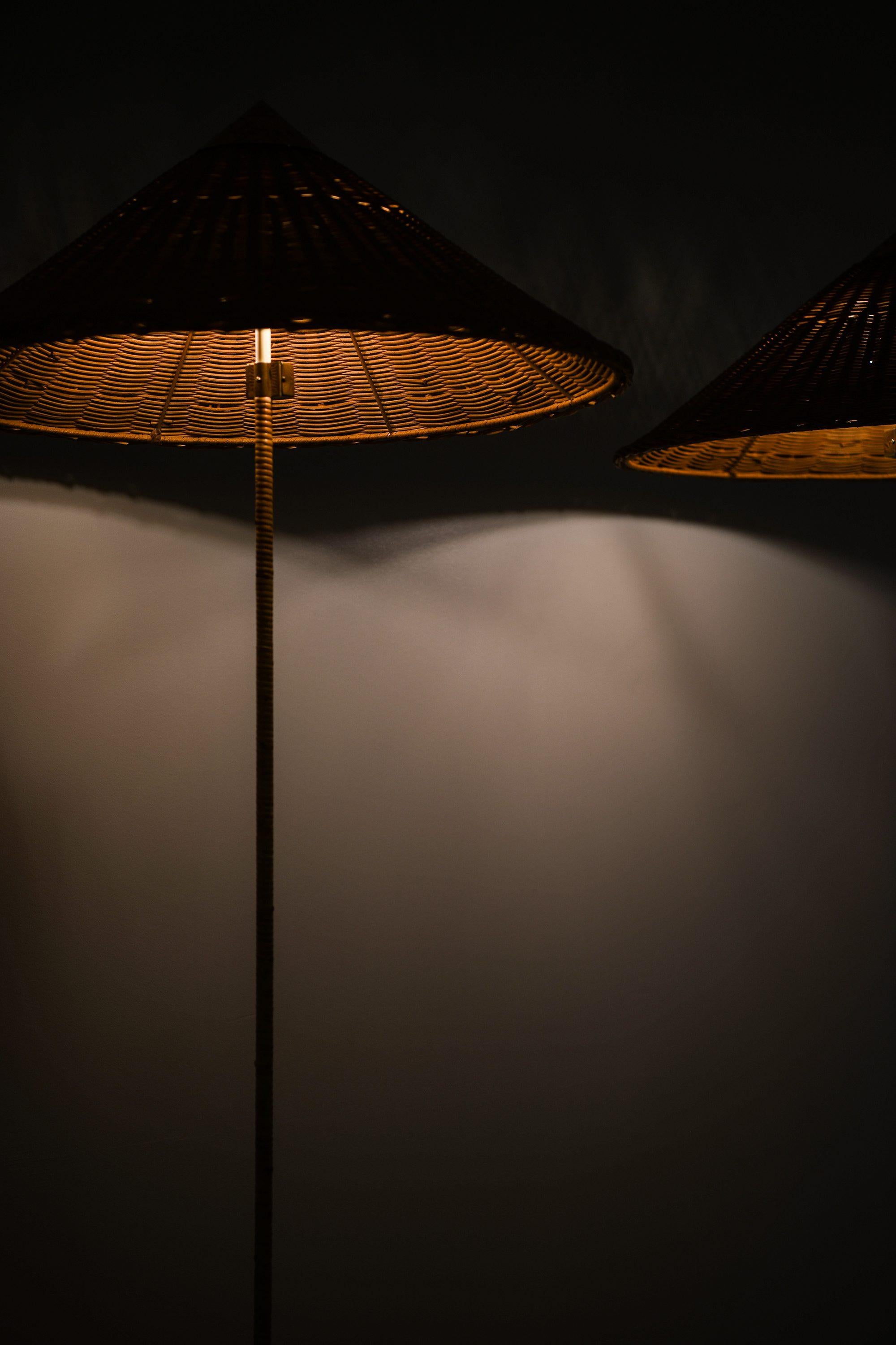 Pair of Floor Lamps in Brass, Cane and Rattan Shades by Paavo Tynell, 1950's For Sale 5