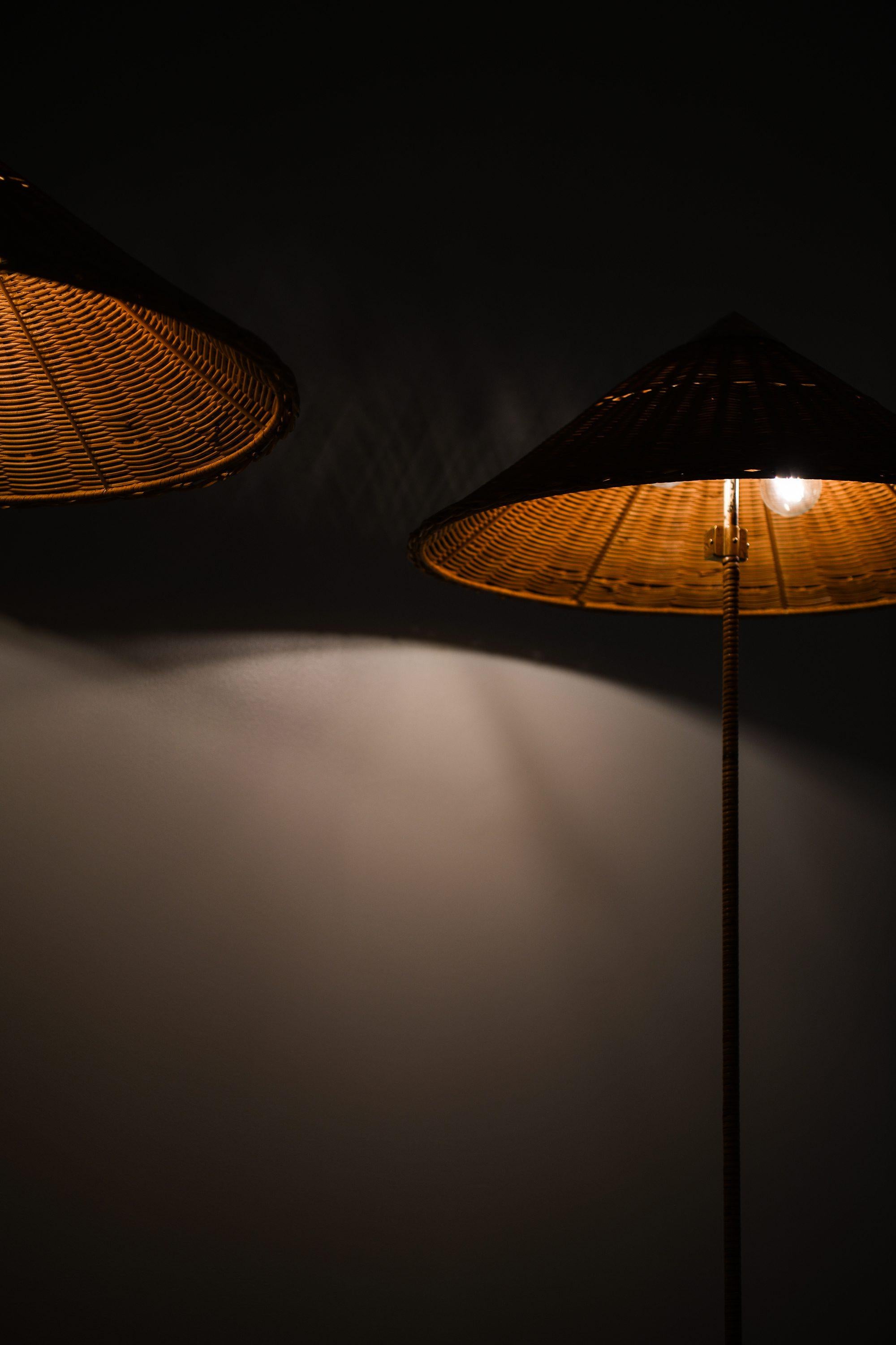 Pair of Floor Lamps in Brass, Cane and Rattan Shades by Paavo Tynell, 1950's For Sale 6