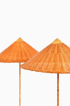 Pair of Floor Lamps in Brass, Cane and Rattan Shades by Paavo Tynell, 1950's