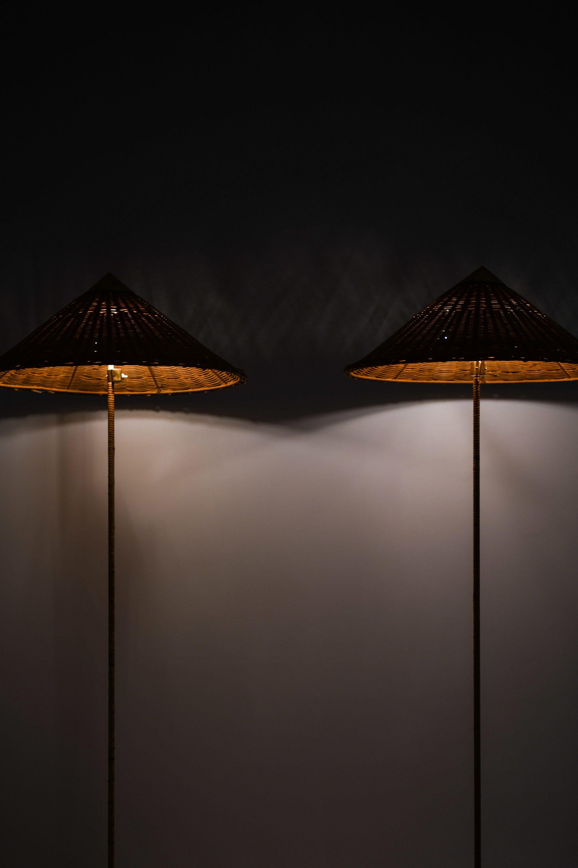Pair of Floor Lamps in Brass, Cane and Rattan Shades by Paavo Tynell, 1950's For Sale 2