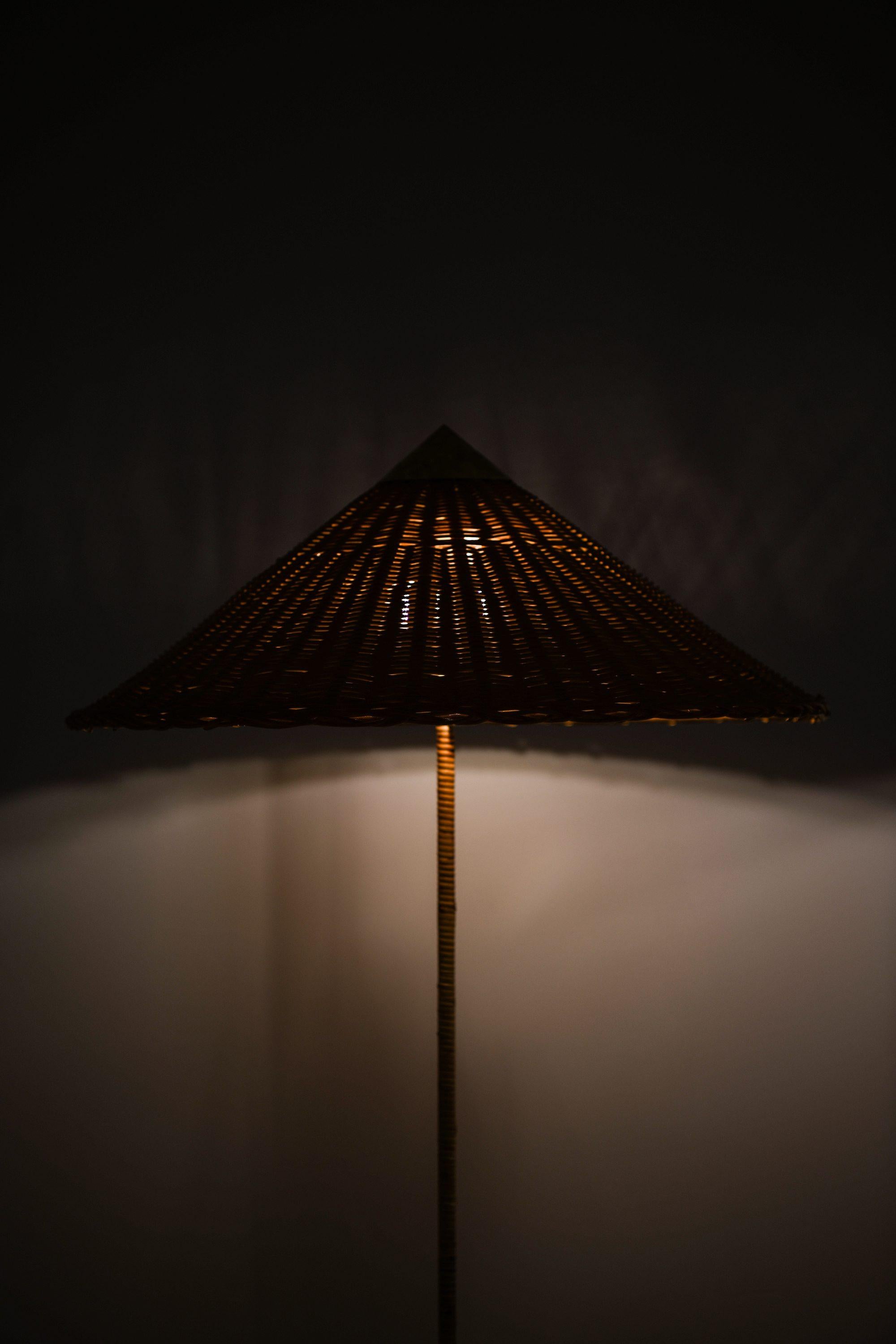Pair of Floor Lamps in Brass, Cane and Rattan Shades by Paavo Tynell, 1950's For Sale 3