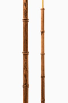 Paire de lampadaires en palissandre et laiton, années 1950