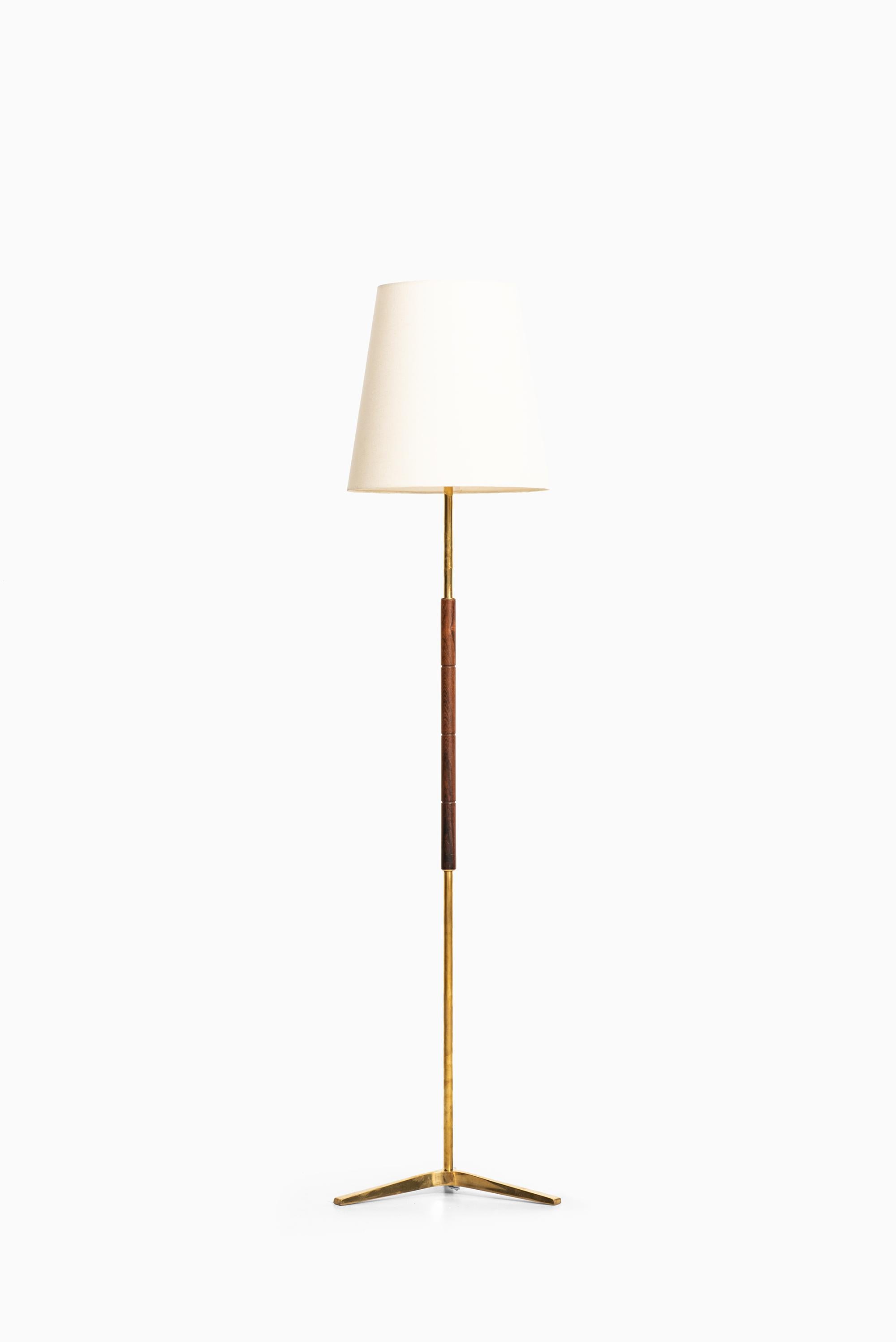 Scandinavian Modern Pair of Floor Lamps in Rosewood and Brass Produced in Denmark