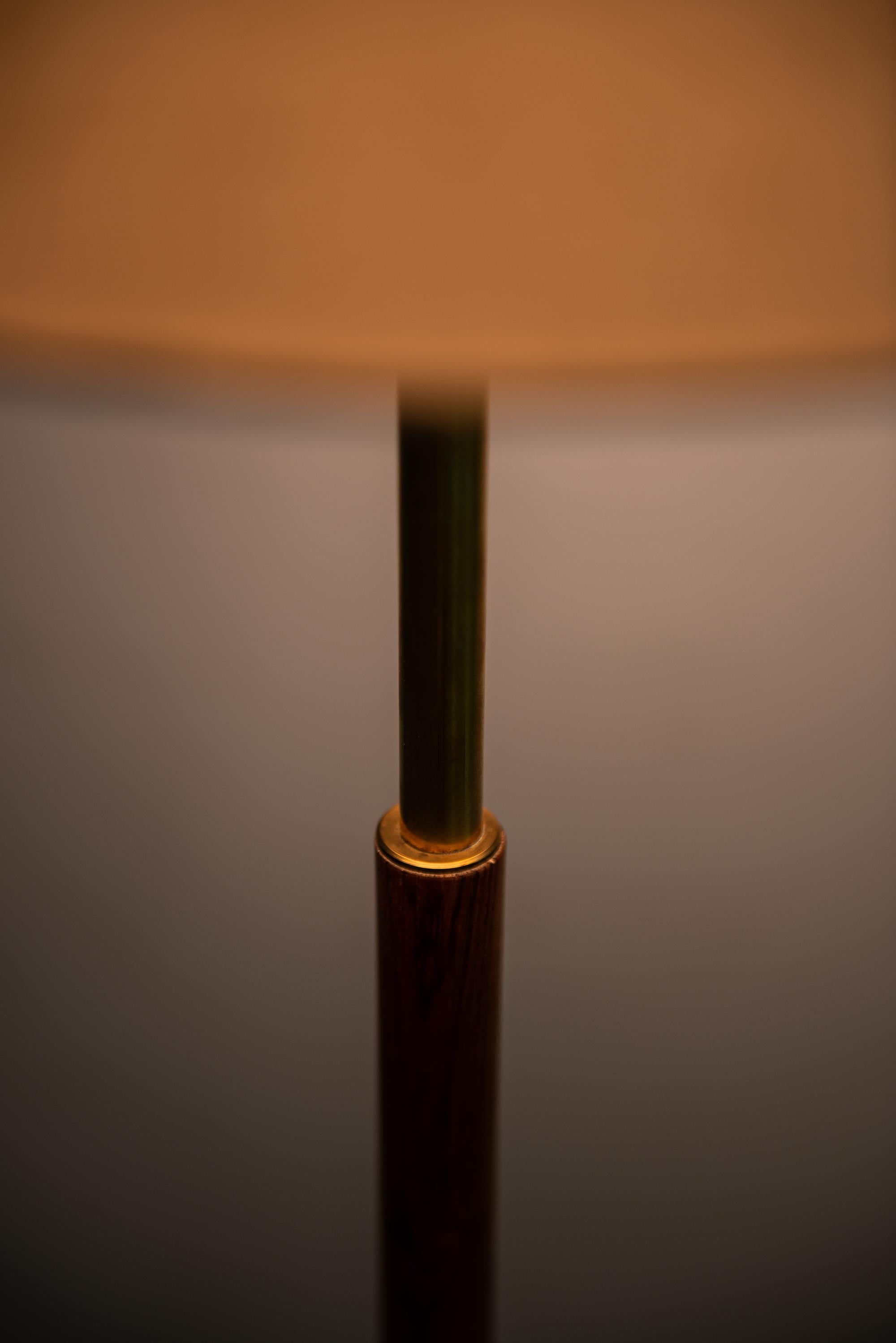 Mid-20th Century Pair of Floor Lamps in Rosewood and Brass Produced in Denmark