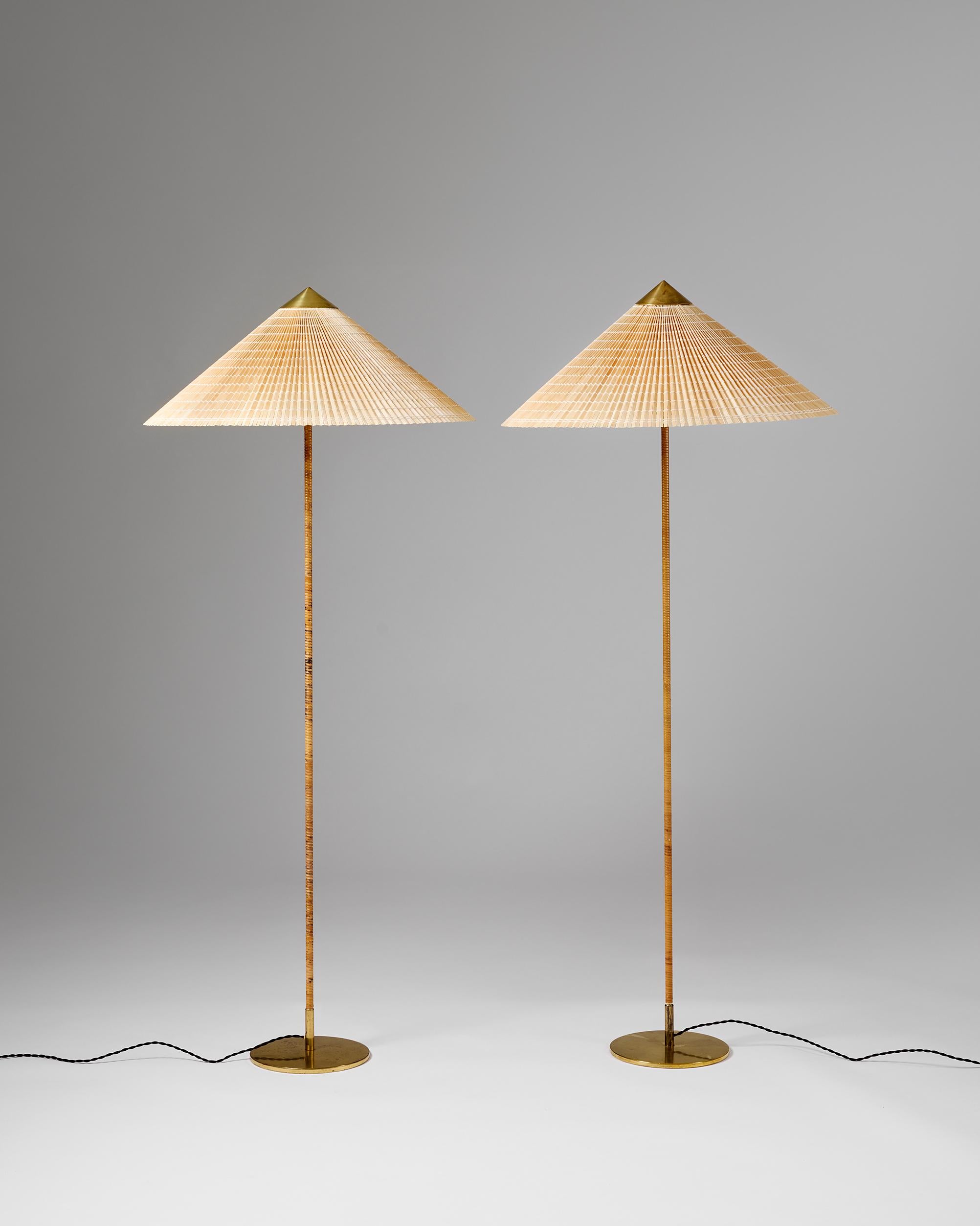 A pair of floor lamps model 9602 designed by Paavo Tynell for Taito Oy, Finland, 1950s. Known as the “Chinese Hat,” this elegant model was originally designed in 1935 for the renowned Hotel Aulanko and has since become one of Tynell’s most