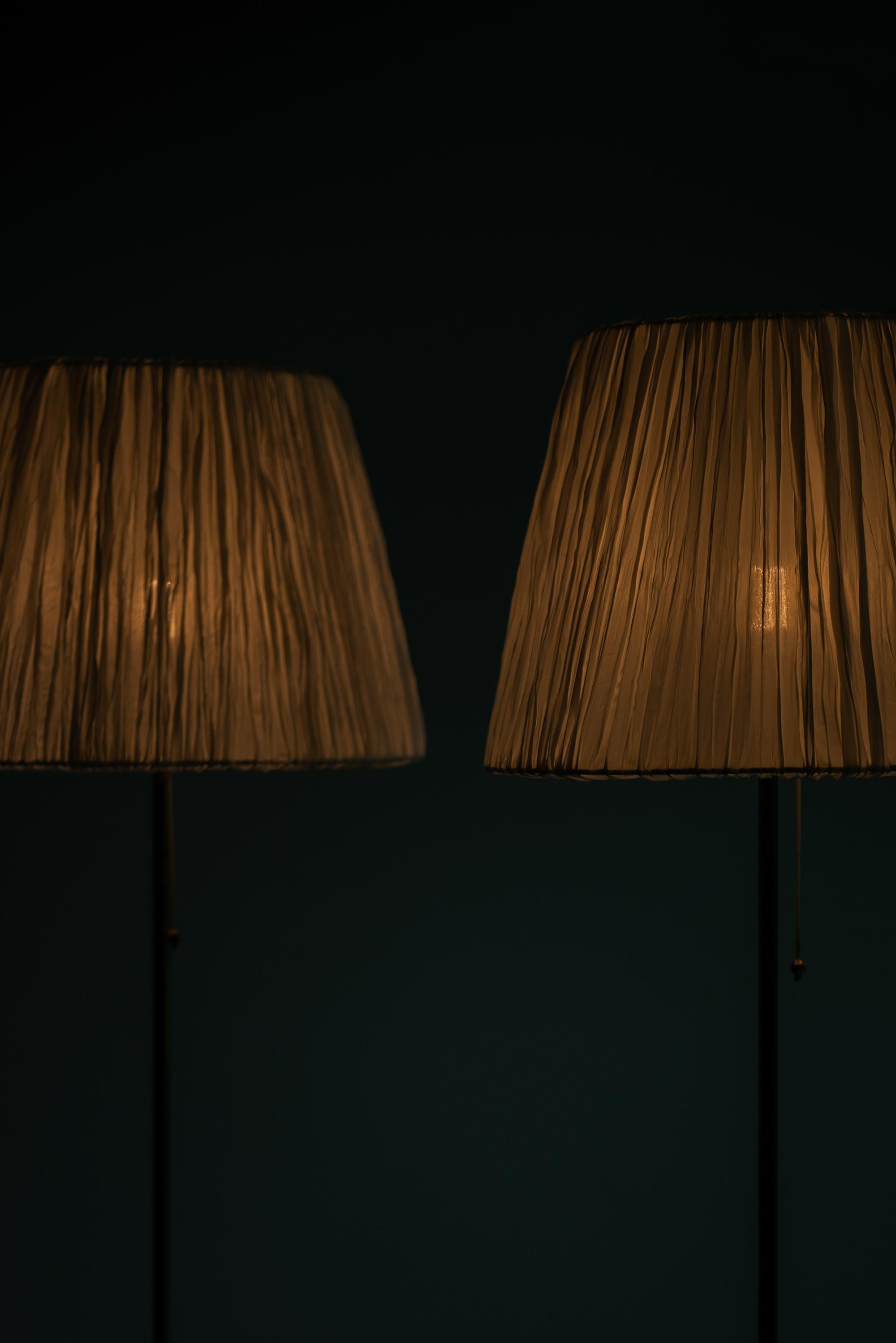 Swedish Pair of Floor Lamps Model G-025 in Brass Produced by Bergbom in Sweden For Sale