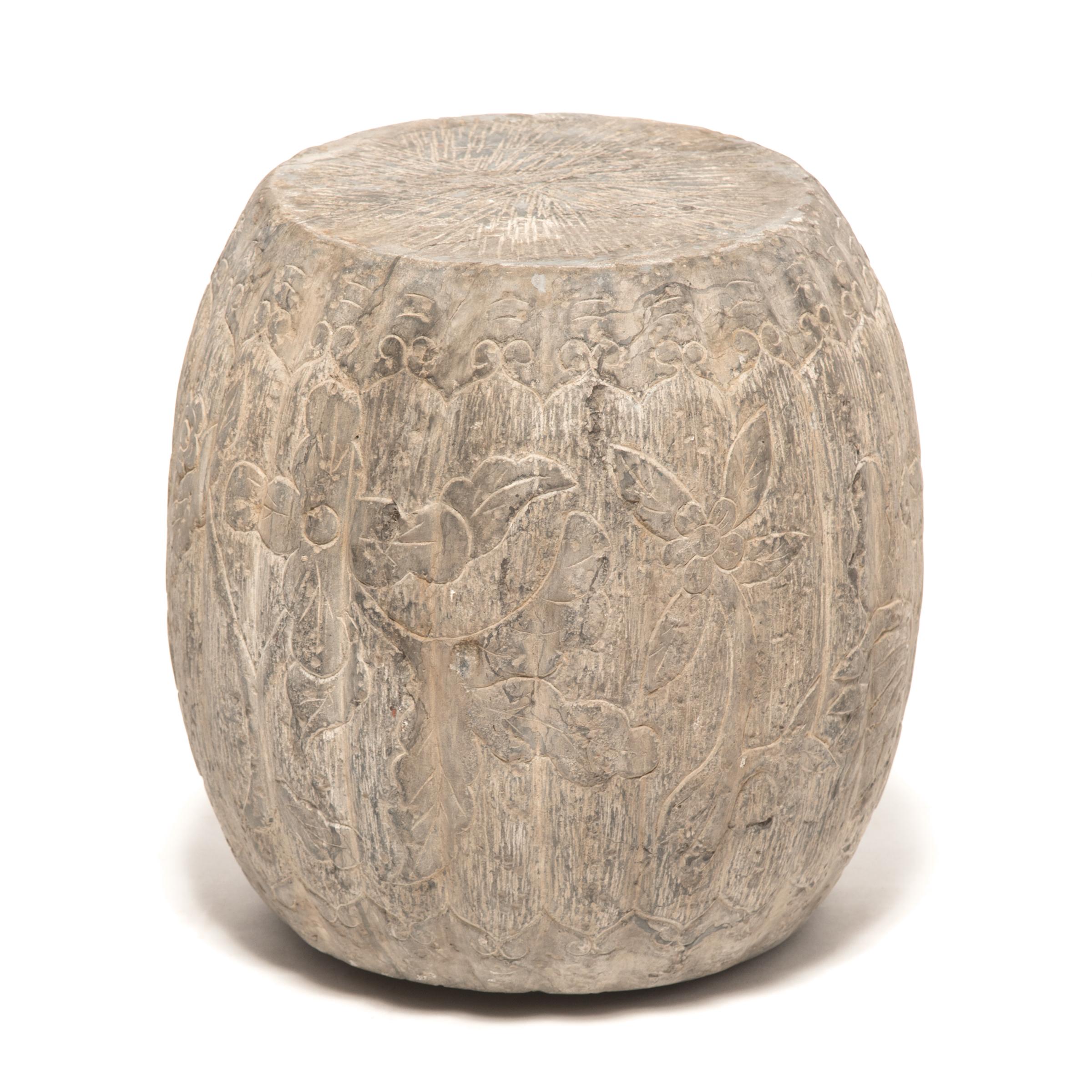 This pair of drum form stools were hand-carved from solid limestone by an artisan in China’s Shanxi province in the late 19th-century. Sculpted to a ridged melon shape, a traditional Chinese symbol of fertility, each drum is incised with trailing