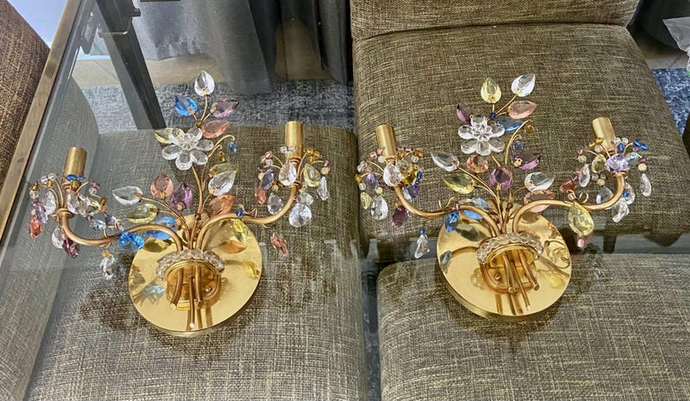 Pair two-light wall sconces designed by Oswald Haerdtl for J.L Lobmeyr. The solid brass structure is welded and polished to create the delicate organic branches. These are decorated with mutli-color hand-polished crystals creating a bouquet of