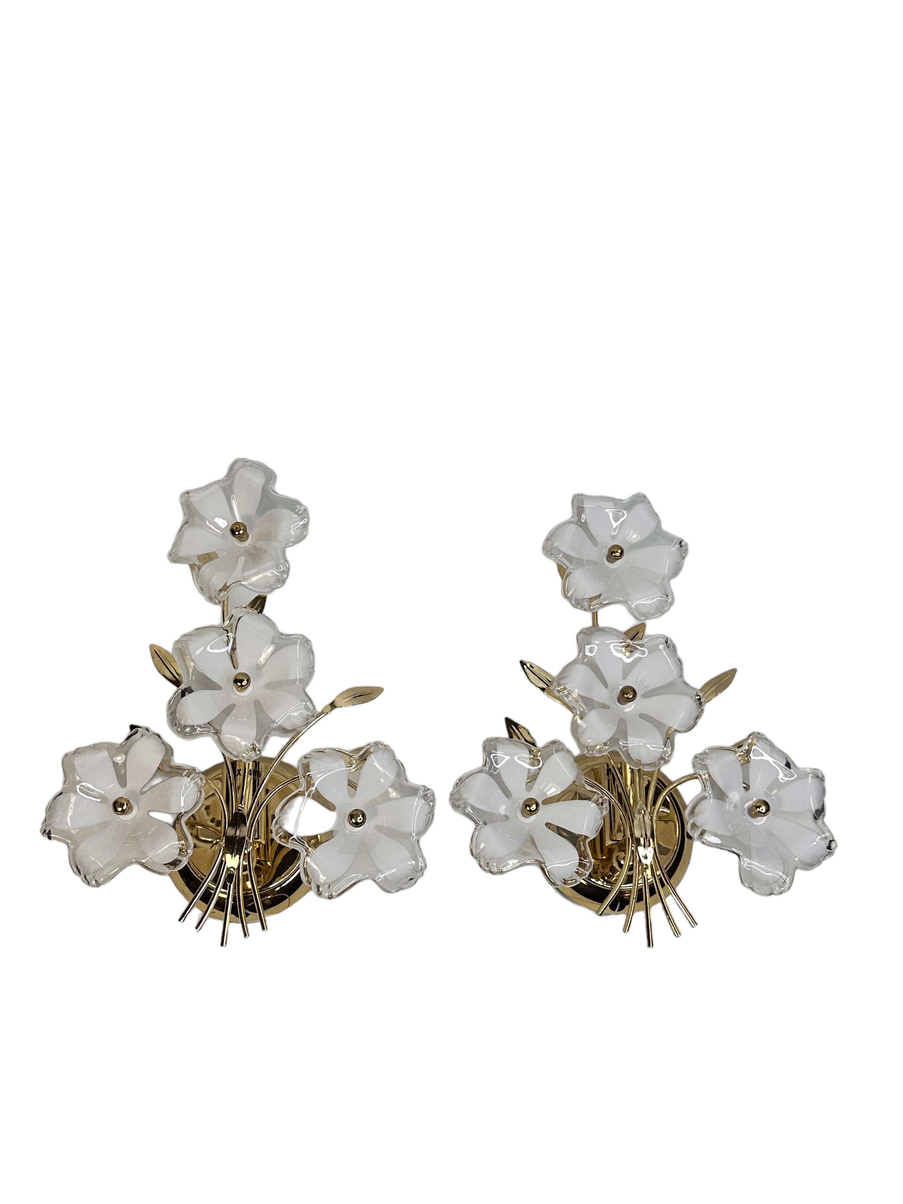 These beautiful wall sconces will make a statement in your home.
The glass flowers are handmade, so each flower is slightly different. This listing is for 2 sconces.
It can be used right away suitable for any electric system, has been rewired and