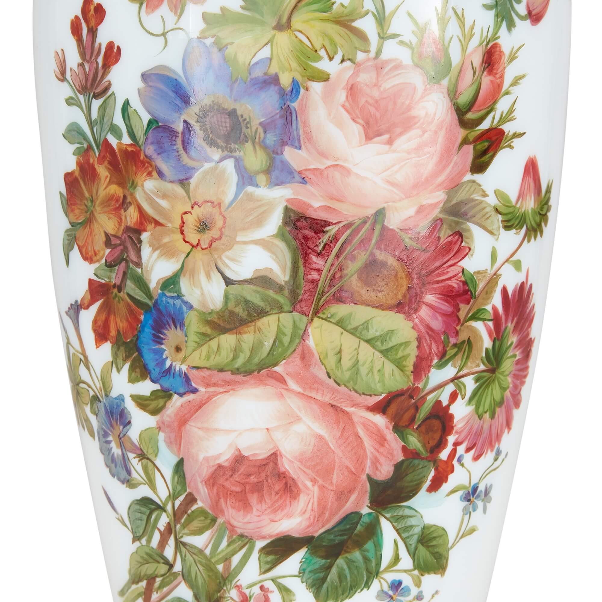 Pair of floral opaline glass vases by Baccarat
French, 19th Century
Height 55.5cm, diameter 20cm

Wonderfully crafted by Baccarat, the renowned French firm of glass manufacturers, this pair of vases is adorned throughout with charming bouquets of