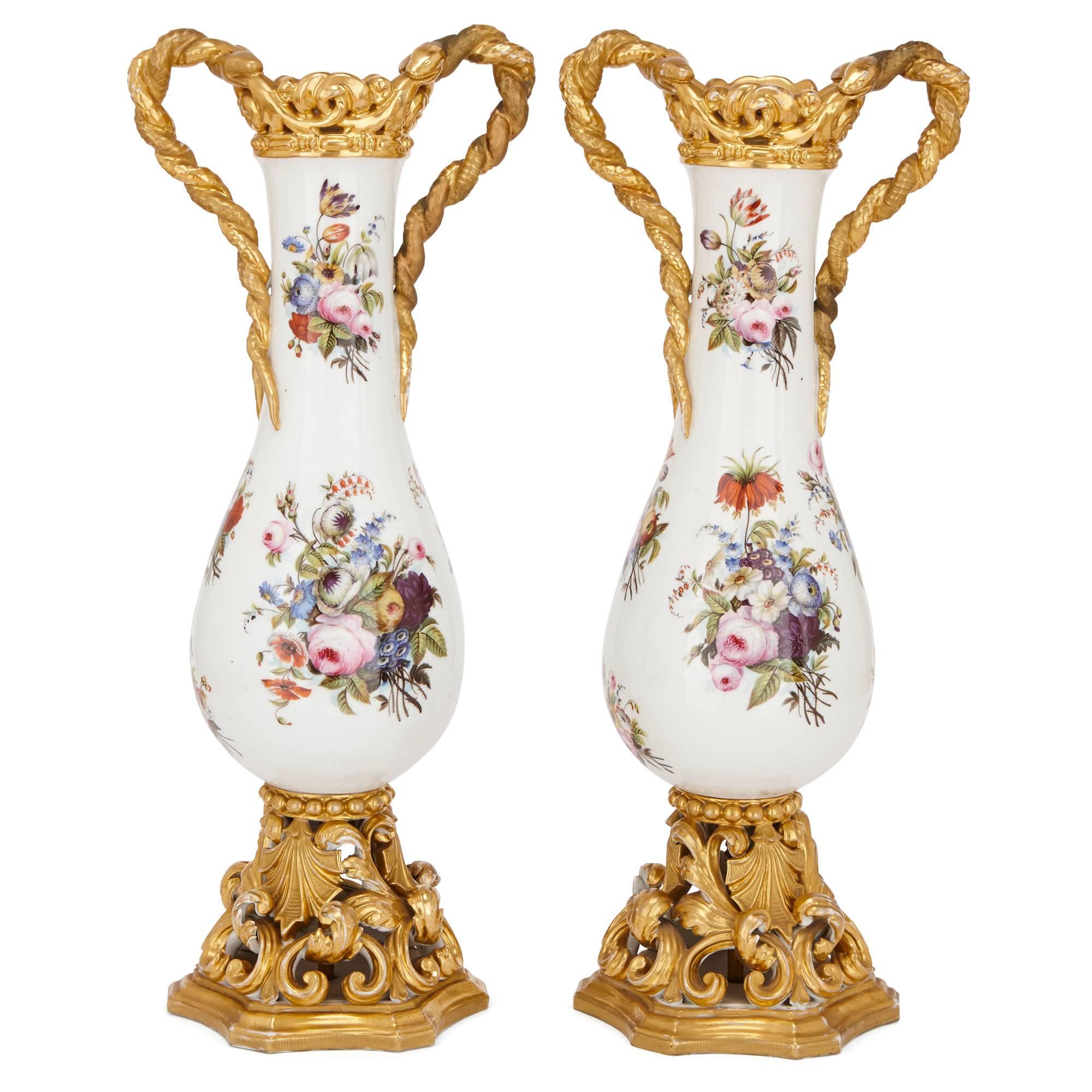 Jacob Petit was perhaps the pre-eminent porcelain artist of the first half of the 19th century in France, and these Belle Époque period floral vases are a clear homage to his innovative techniques. Perhaps the most striking feature of the vases are