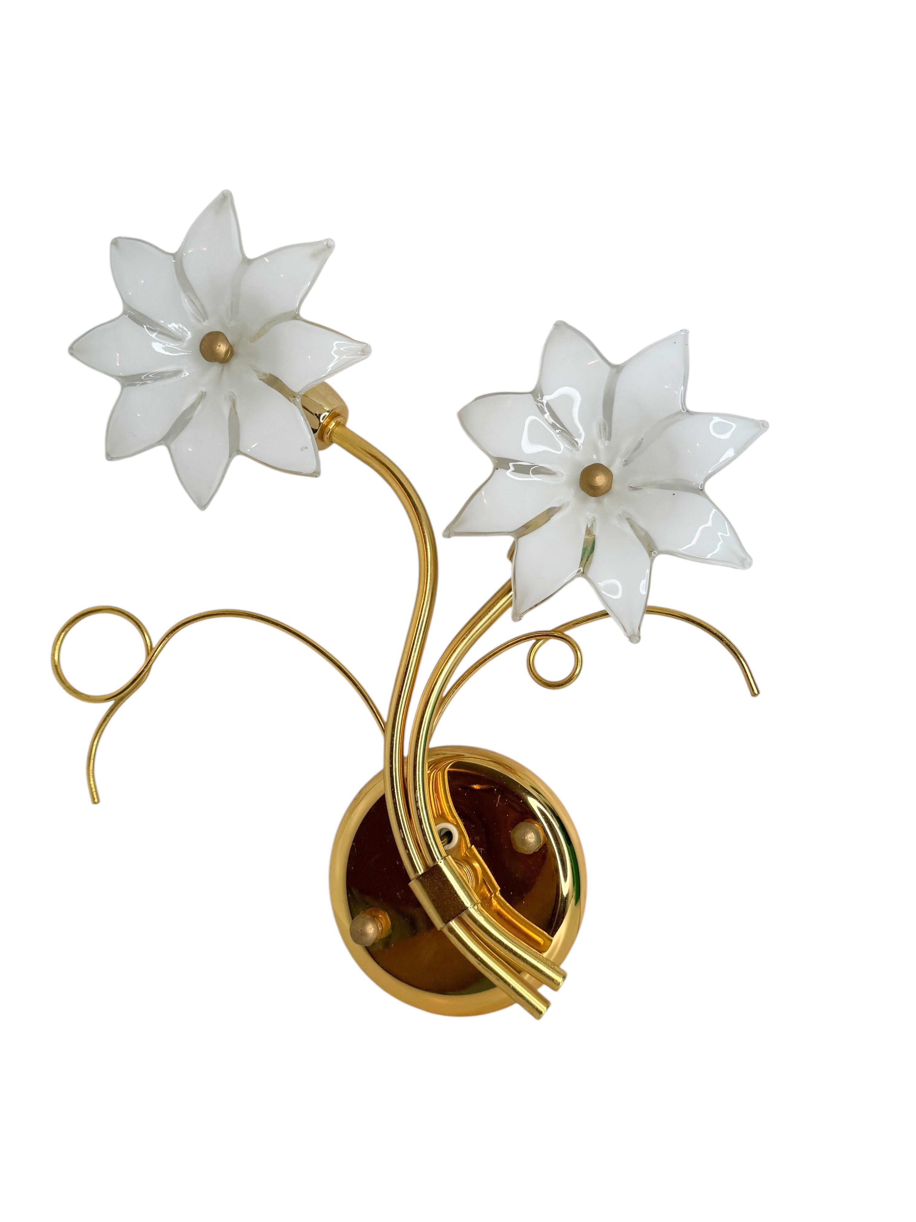 These beautiful wall sconces will make a statement in your home.
The glass flowers are handmade, so each flower is slightly different. This listing is for 2 sconces.
It can be used right away suitable for any electric system, has been rewired and