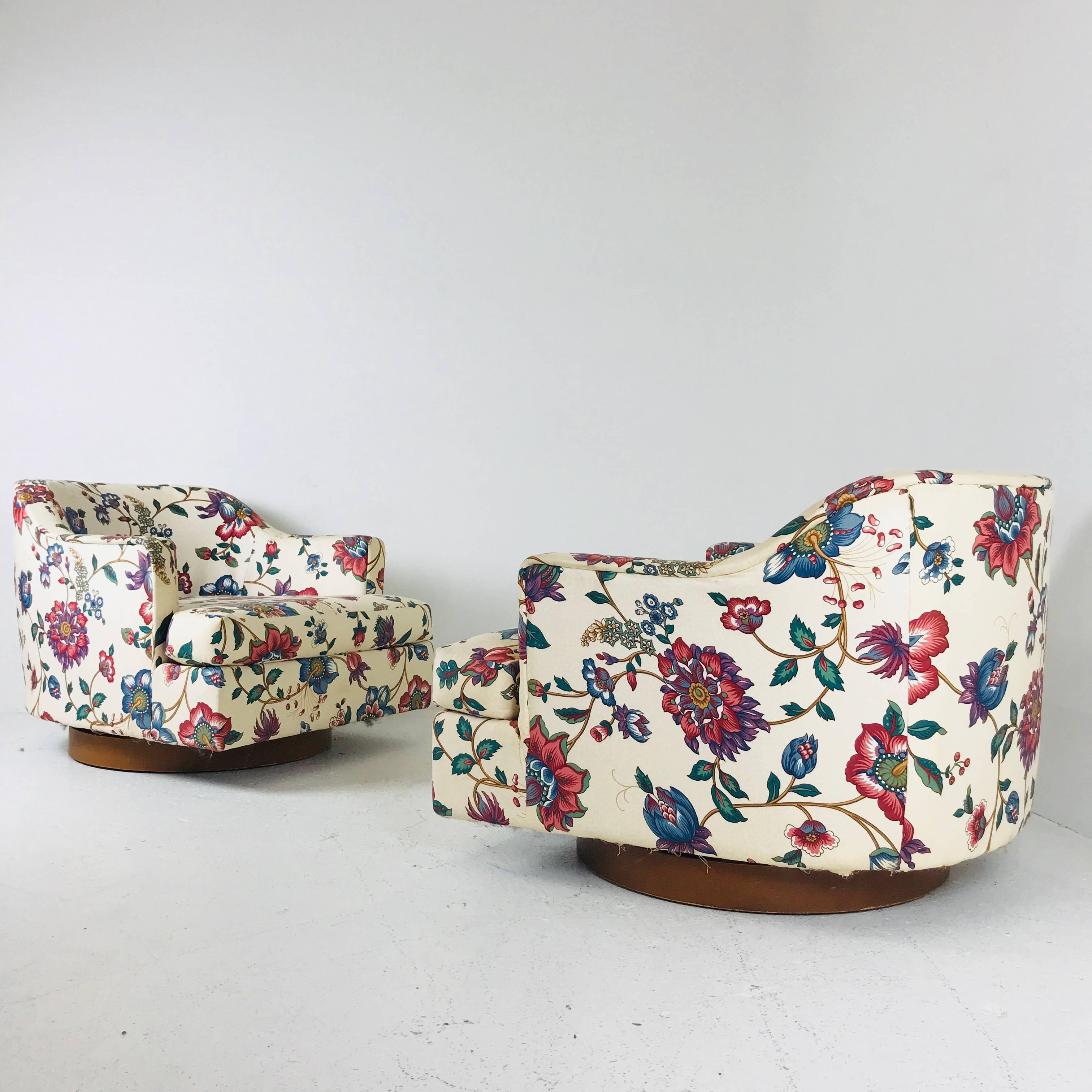 Mid-Century Modern Pair of Floral Swivel Chairs in the Style of Milo Baughman.