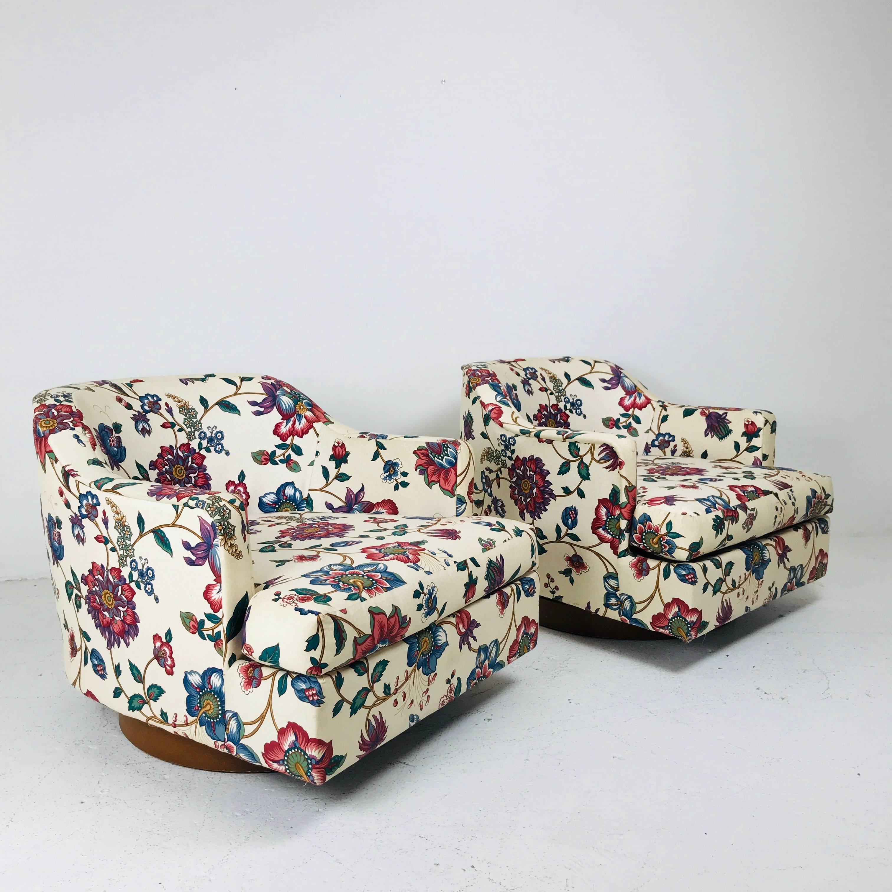 20th Century Pair of Floral Swivel Chairs in the Style of Milo Baughman.