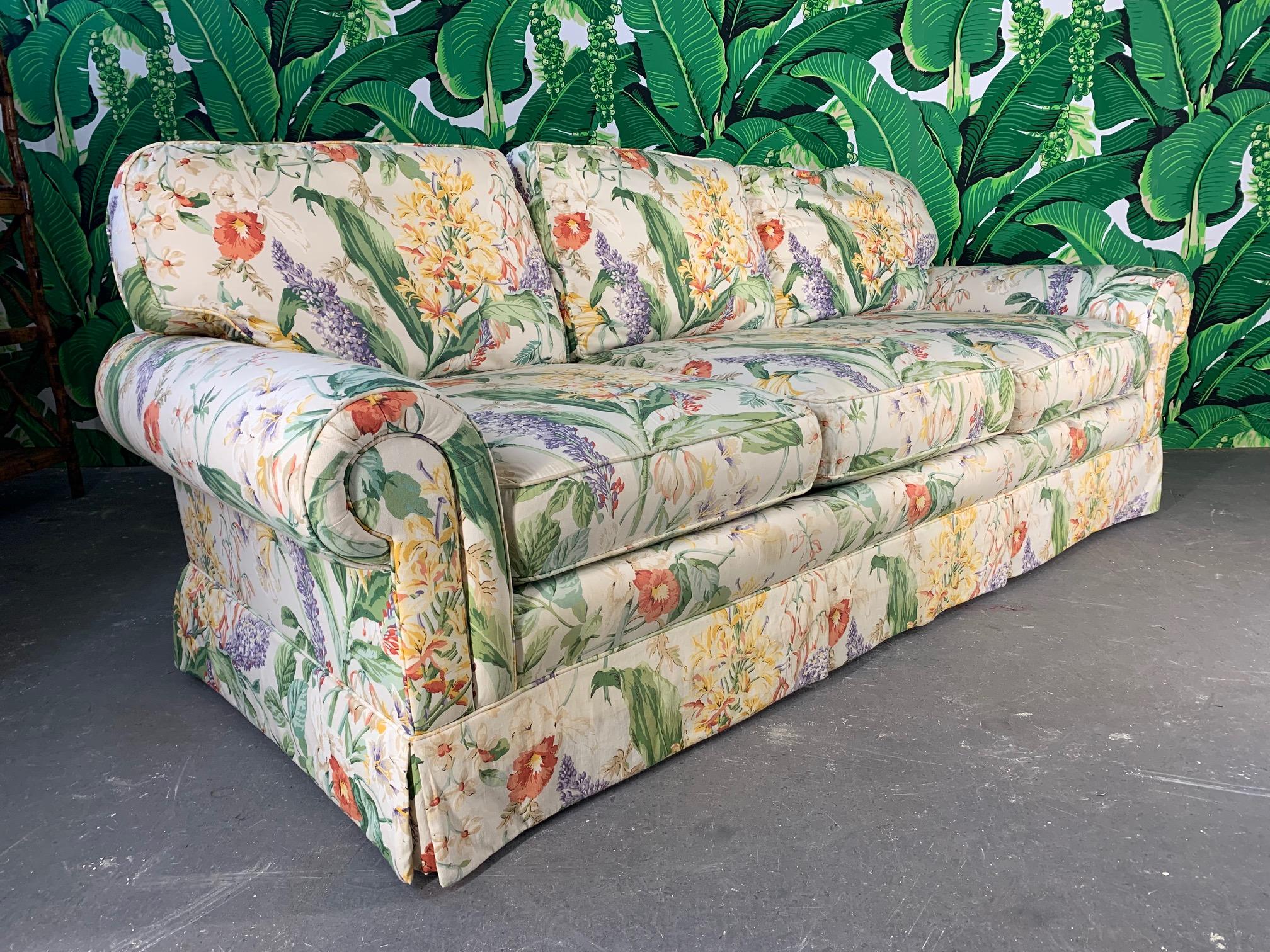 Pair of matching floral upholstered sofas by Robb & Stucky. Very comfortable and a striking print that makes a statement. Very good vintage condition with no odors, rips, or obvious stains. There are some very slight discolorations in a few small