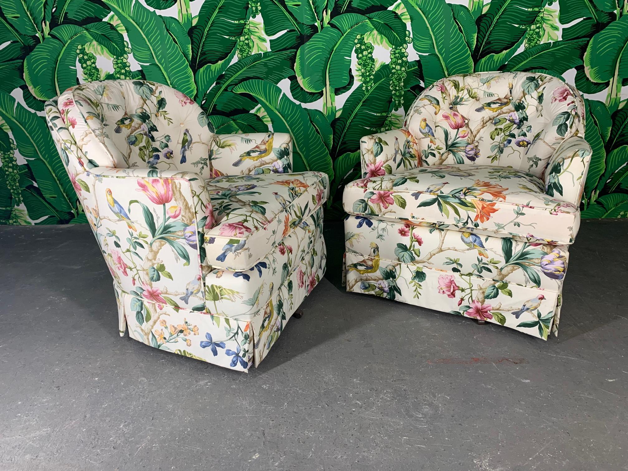 Pair of swivel club chairs upholstered in a fabulous floral print. Very good vintage condition overall.
