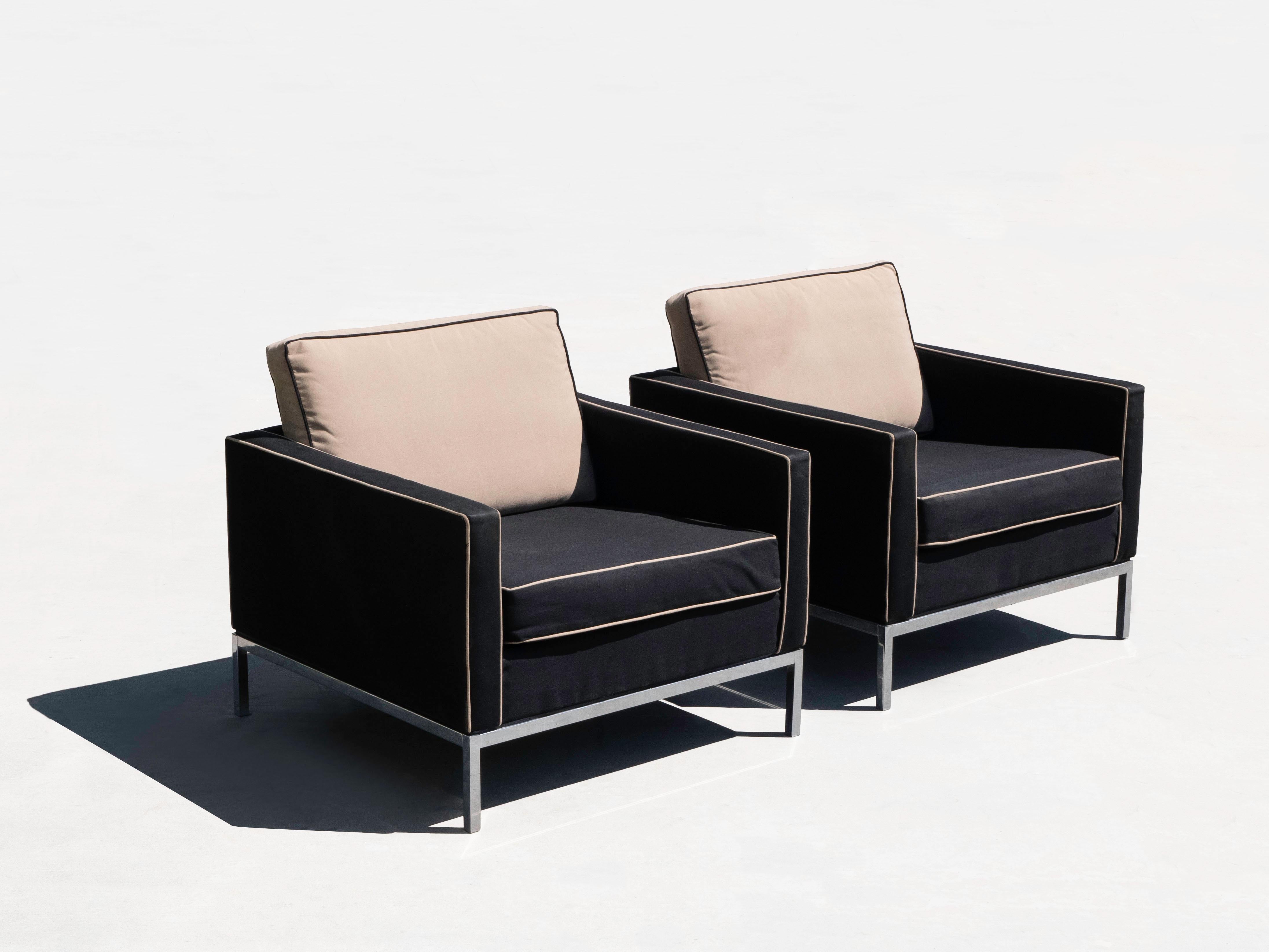 Florence Knoll designed club / lounge chairs for knoll, circa 1970's. Both chairs retain knoll labels. The chairs have been recovered at some point in a two tone fabric. The fabric is without tears or rips and in usable condition, however they could