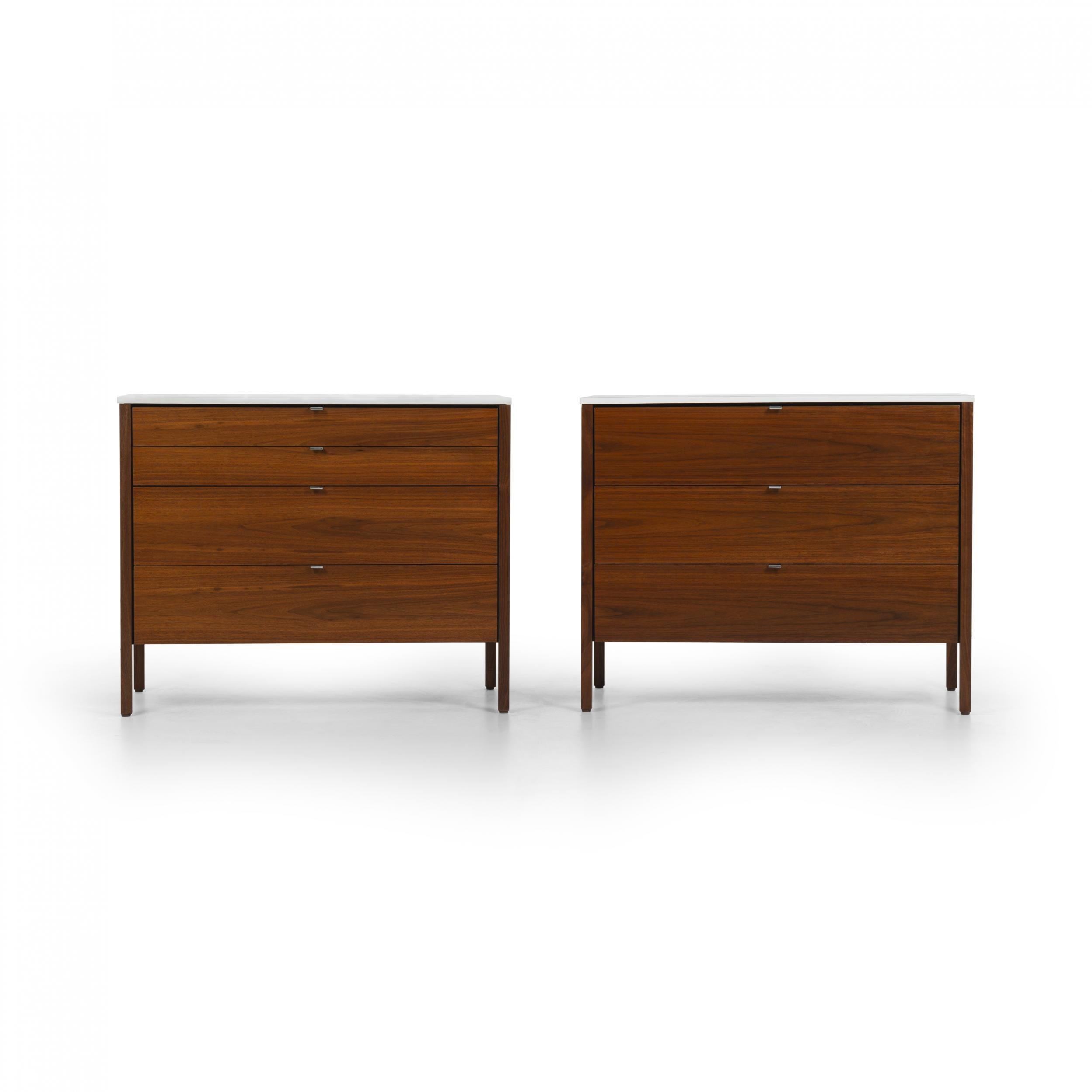 Pair of Florence Knoll Dressers, model 324-1 nicely figured walnut cases with oil finish, One case 4 drawers the other 3drawers with satin aluminum pulls with laminated plastic durable tops. Label underside [Knoll International].