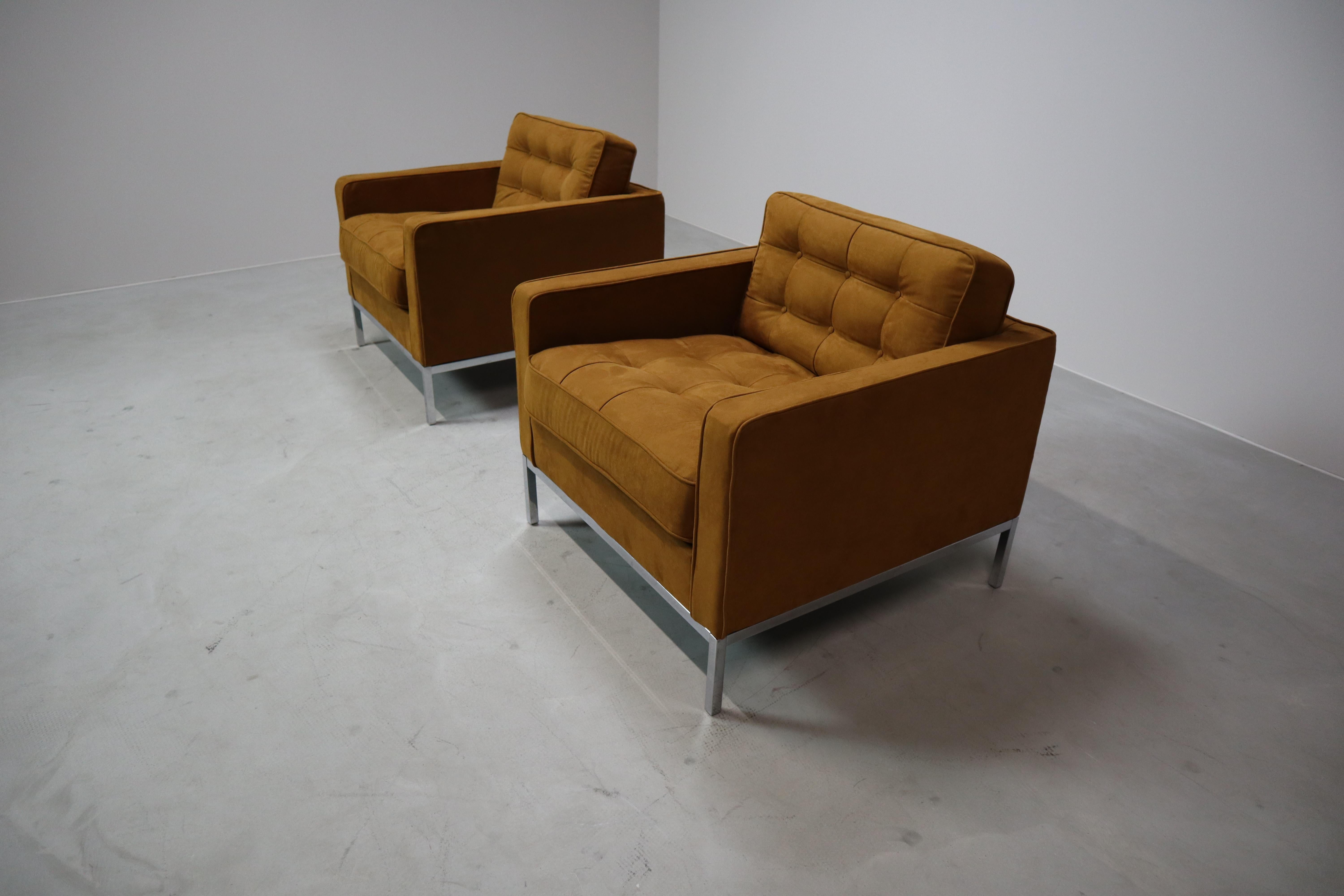 This pair of original lounge chairs, designed by Florence Knoll for Knoll International in the 1950s, captures the essence of mid-century modern design. With their clean architectural lines, boxy silhouette, and polished chrome base, these chairs