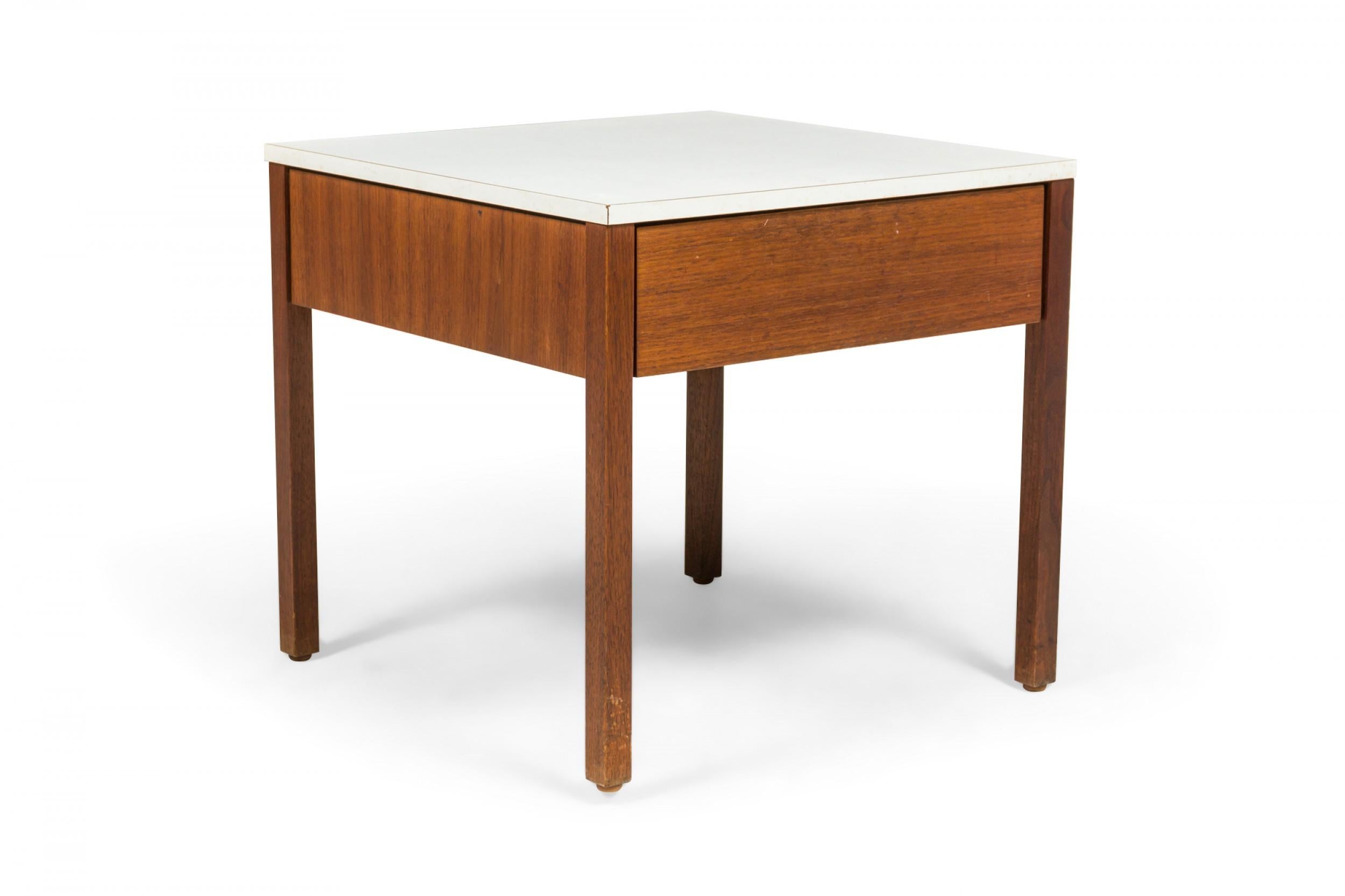 Pair of American mid-century square nightstands / end tables with white laminate tops above a walnut base with a single drawer, resting on four square walnut legs. (FLORENCE KNOLL FOR KNOLL INTERNATIONAL)(PRICED AS PAIR)
