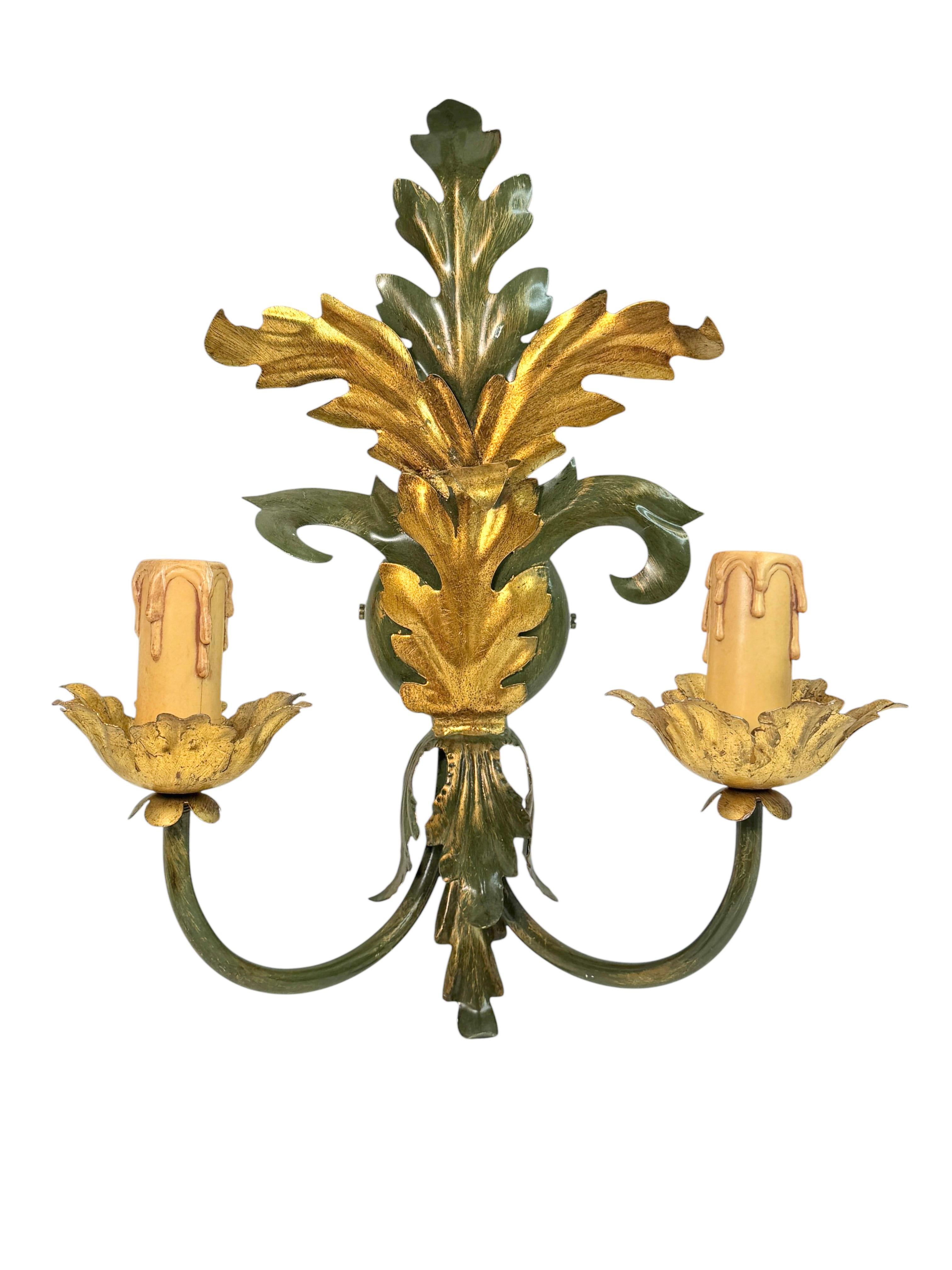 A beautiful pair of sconces with 2 lights that was made in Austria, probably by Eglo Leuchten, circa 1980s.
Each sconce is made in dark green and gilt metal. The color combination of the pieces are very special and it shows gold gilding, beautiful
