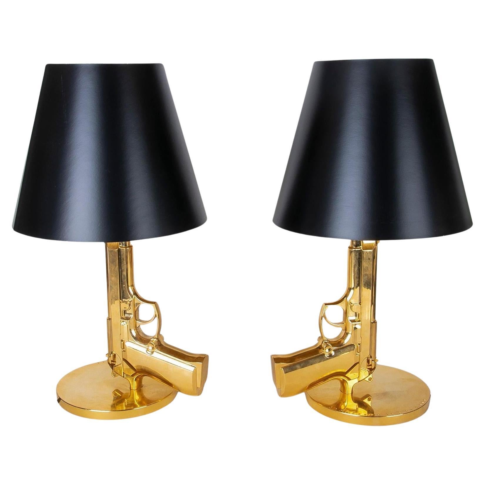 Pair of FLOS Guns Collection Table Lamps in Gold by Philippe Starck For Sale