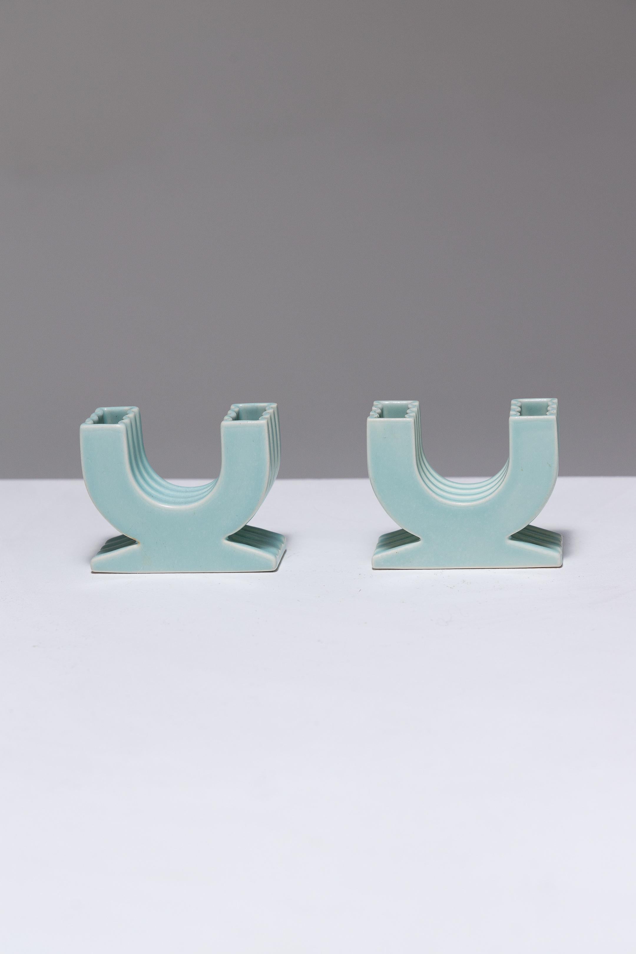 Pair of Turquoise Cloudy Earthenware Flower Holders with Two Arms, by ROBJ during the 1930s. They rest on pedestal bases, featuring wavy borders on both the bases and the branches, characteristic of Robj's refined and delicate production. Marked
