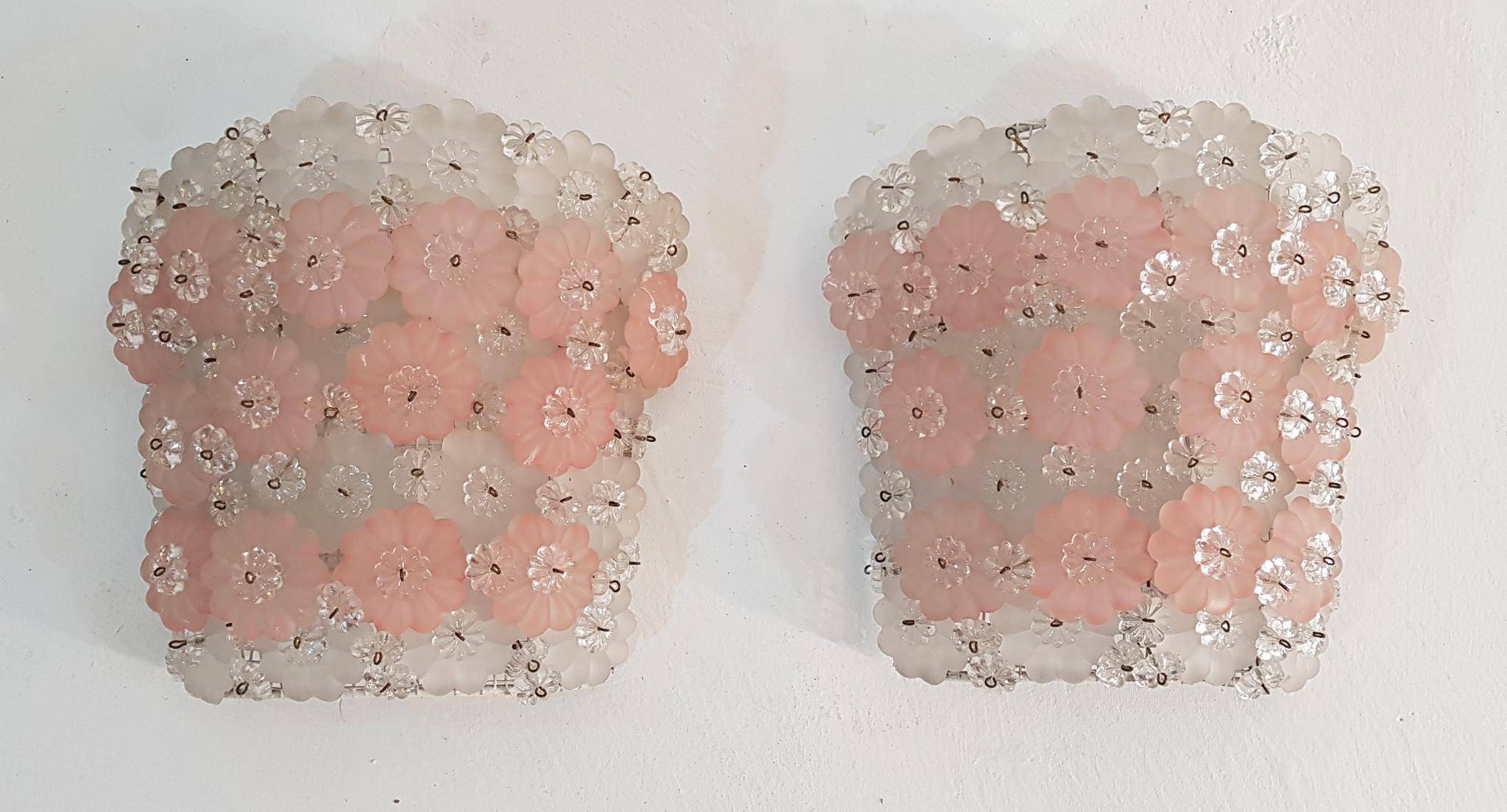 Pair of wall sconces made in Murano Italy and created from clear small and frosted larger glass flowers in white and pastel pink on a steel frame. Each sconce has room for two E27 lightbulbs.