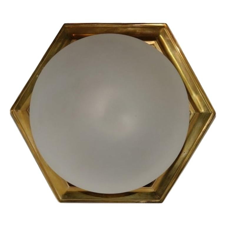 Pair of French circa 1940s gilt bronze hexagonal flush mounted light fixtures with frosted glass inset. Sold individually.

Measurements:
Drop: 6