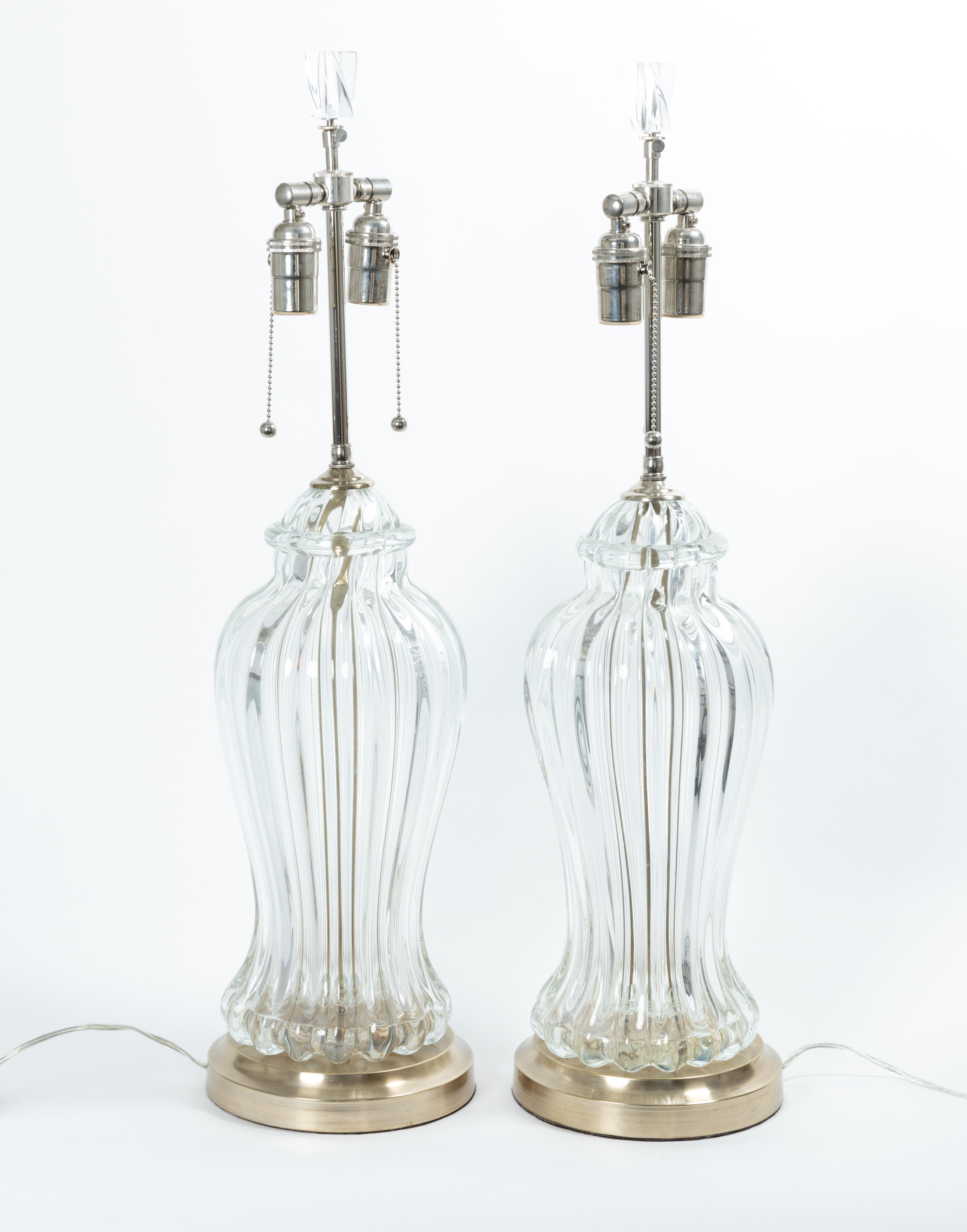 Pair of fluted clear Murano glass table lamps with nickel detail.