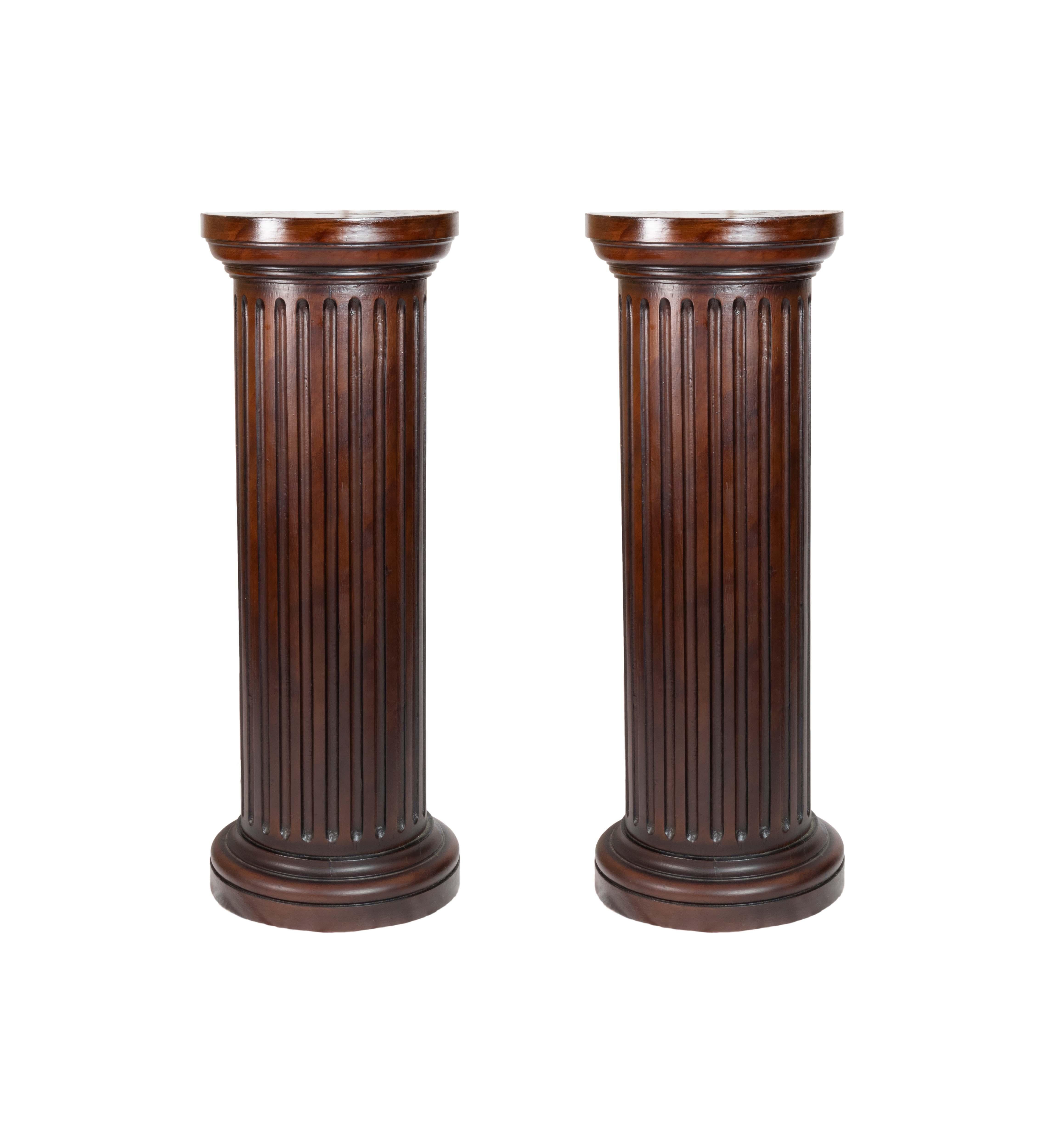 This pair of 19th-century French columns showcases the Louis Philippe style, featuring a lacquered doucine finish in a rich Chocolate Brown hue. 
The fluted details and horizontal cornice evoke a classic, timeless aesthetic, while the Doric-inspired