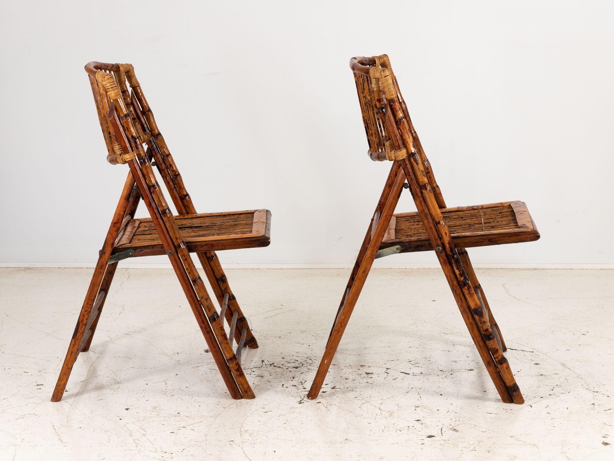 This lovely pair of folding garden chairs are crafted with the timeless beauty of bamboo. These green-friendly chairs seamlessly blend natural elegance with practical functionality. The bamboo frames provide exceptional durability while exuding a