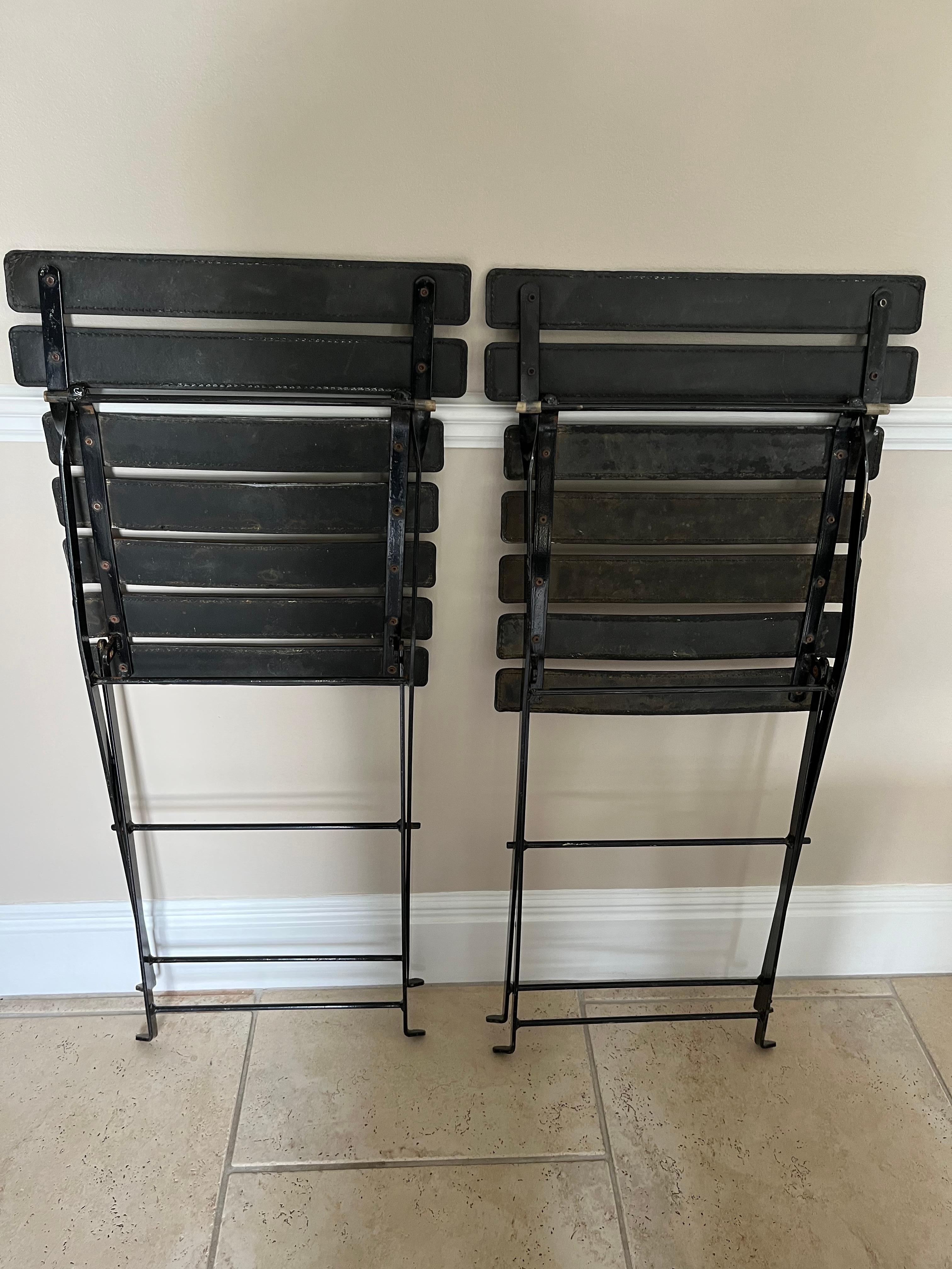 Mid-Century Modern Pair of folding chairs in the manner of Jacques Adnet