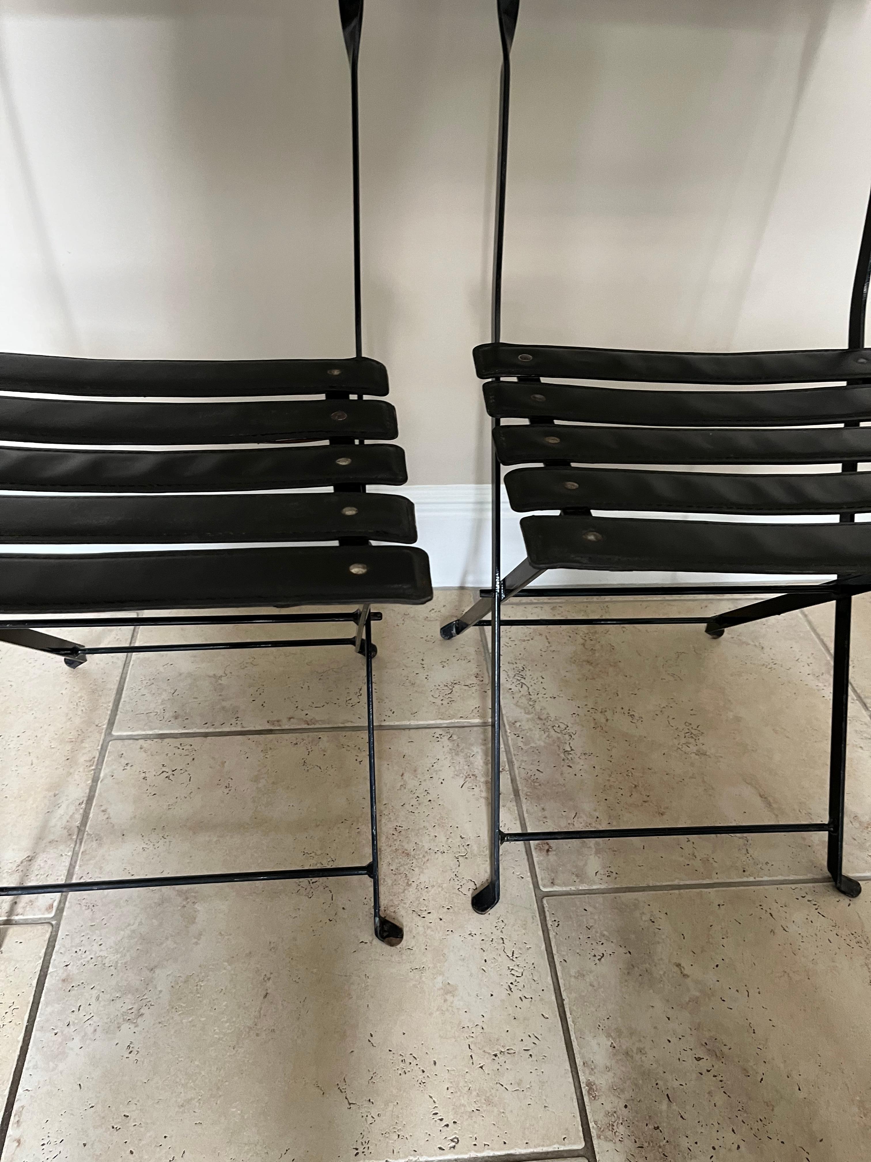 Pair of folding chairs in the manner of Jacques Adnet In Good Condition In London, GB
