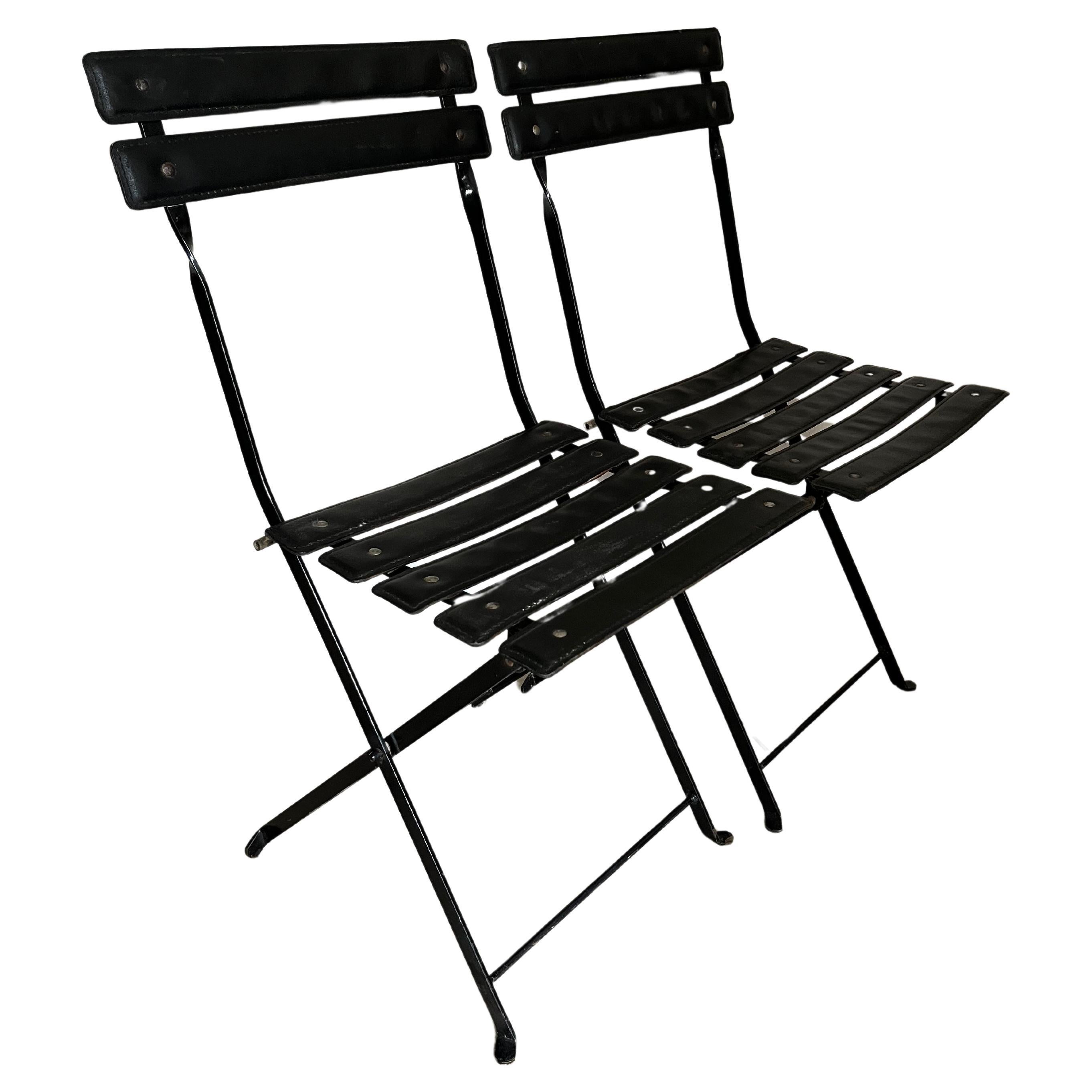 Pair of folding chairs in the manner of Jacques Adnet