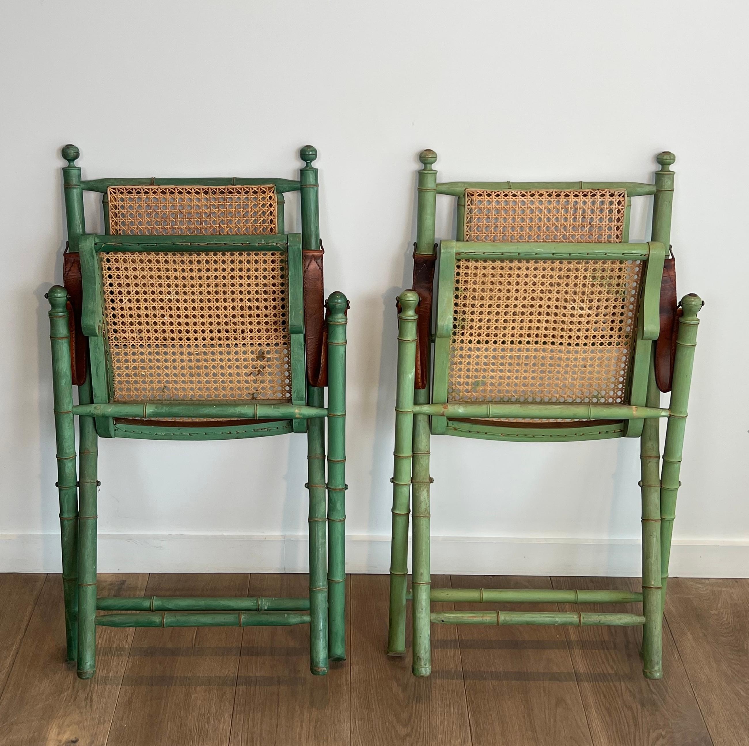 Mid-Century Modern Pair of Folding Safari Chairs in Patinated Faux-Bamboo with Caned Backs and Seat For Sale