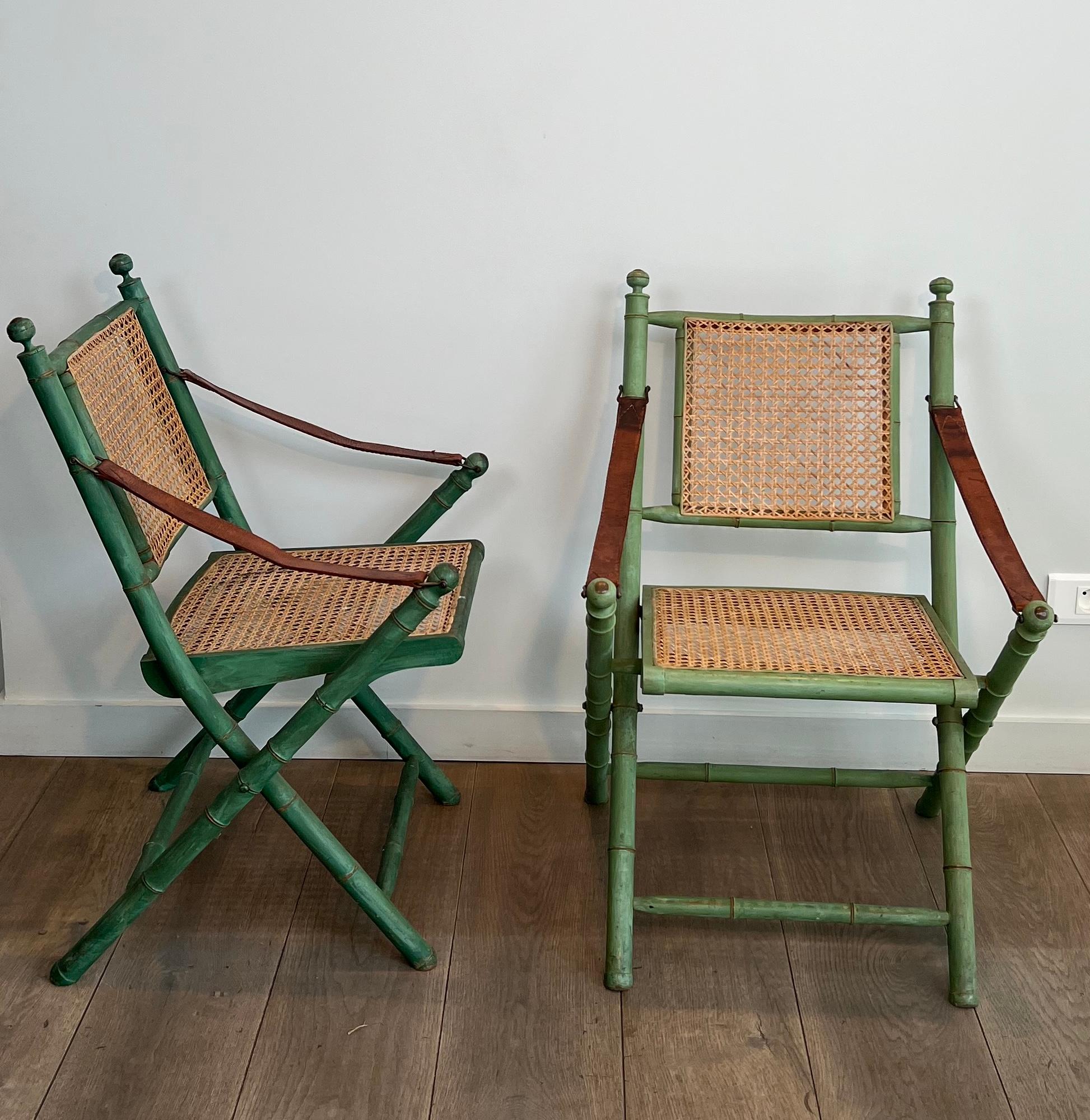 French Pair of Folding Safari Chairs in Patinated Faux-Bamboo with Caned Backs and Seat For Sale