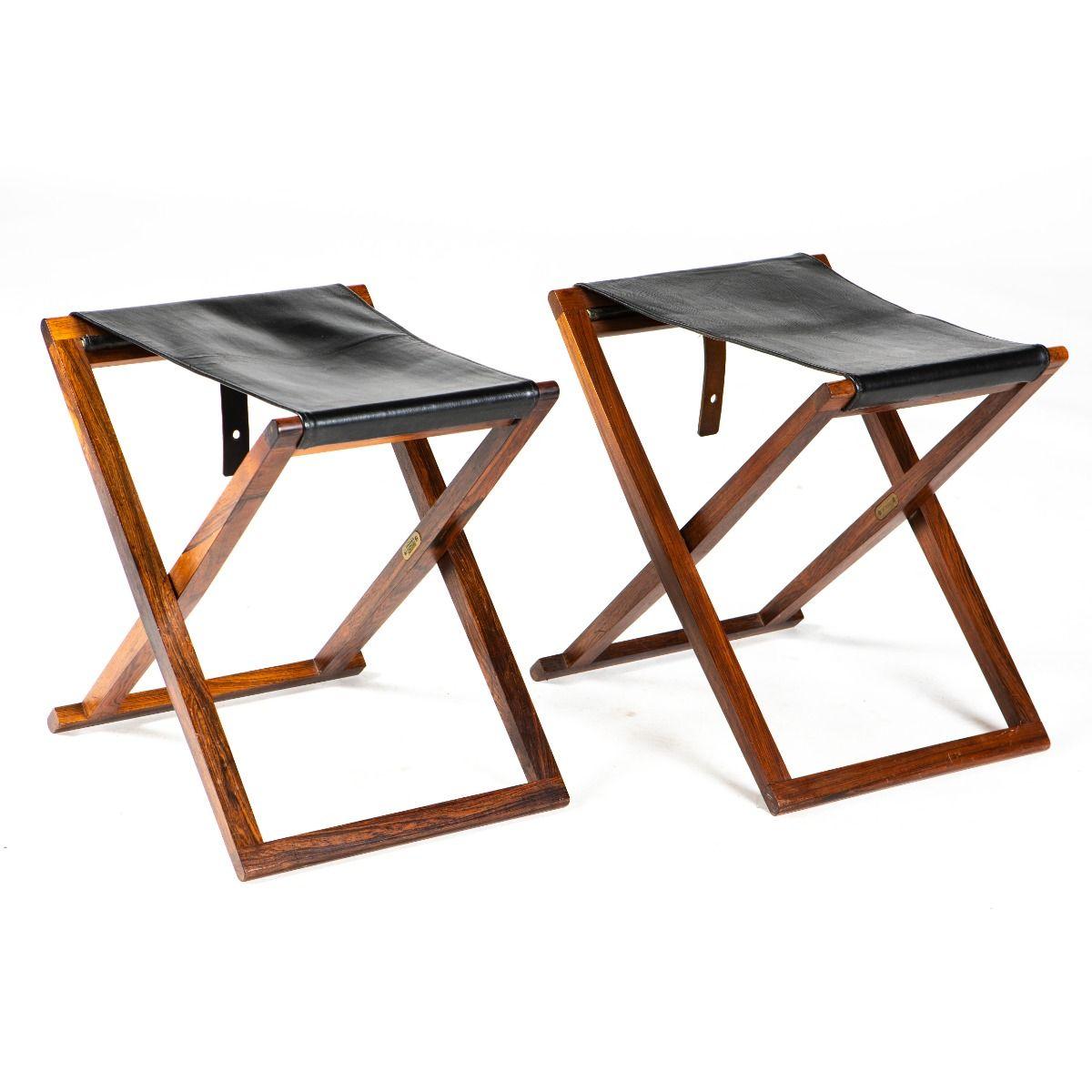 Mogens Koch (Danish, 1898–1992)

A pair of folding stools crafted in noble wood with seats in black leather, fitted with leather straps for hanging and easy storage.
Produced in the 1950s by and in collaboration with Interna, Denmark, with brass