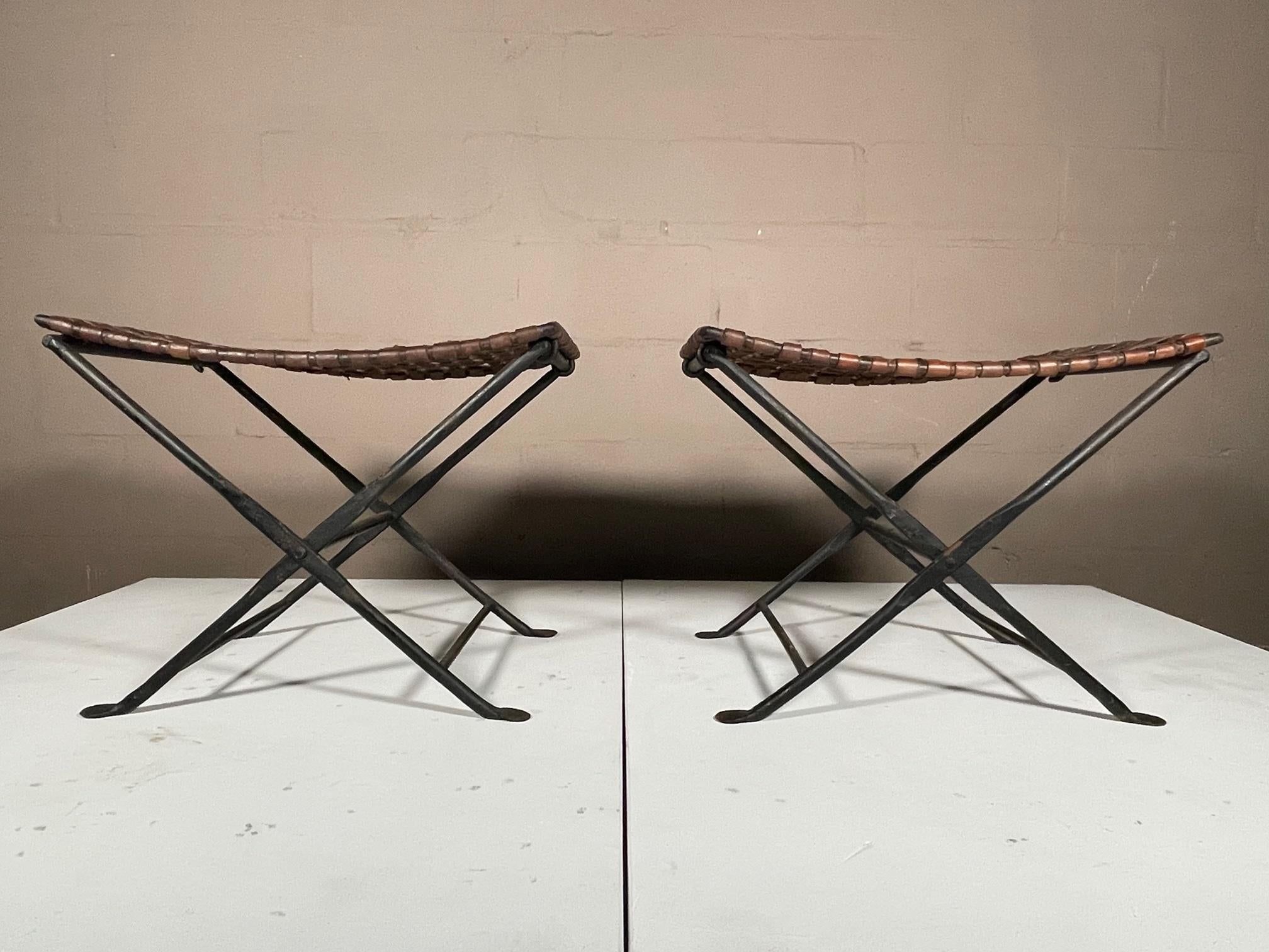 A great pair of folding stools, leather and wrought iron. Beautiful patina, wrought iron is solid and heavy. Priced $1,800 for the pair.