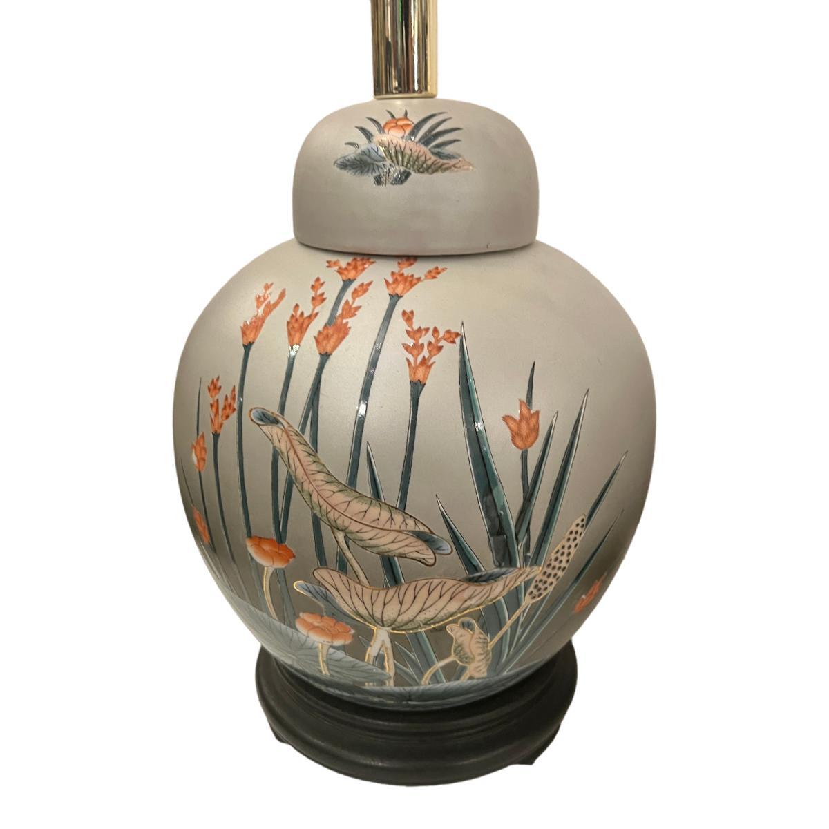 Pair of circa 1960's American foliage motif porcelain lamps with wood bases.

Measurements:
Height of body: 13