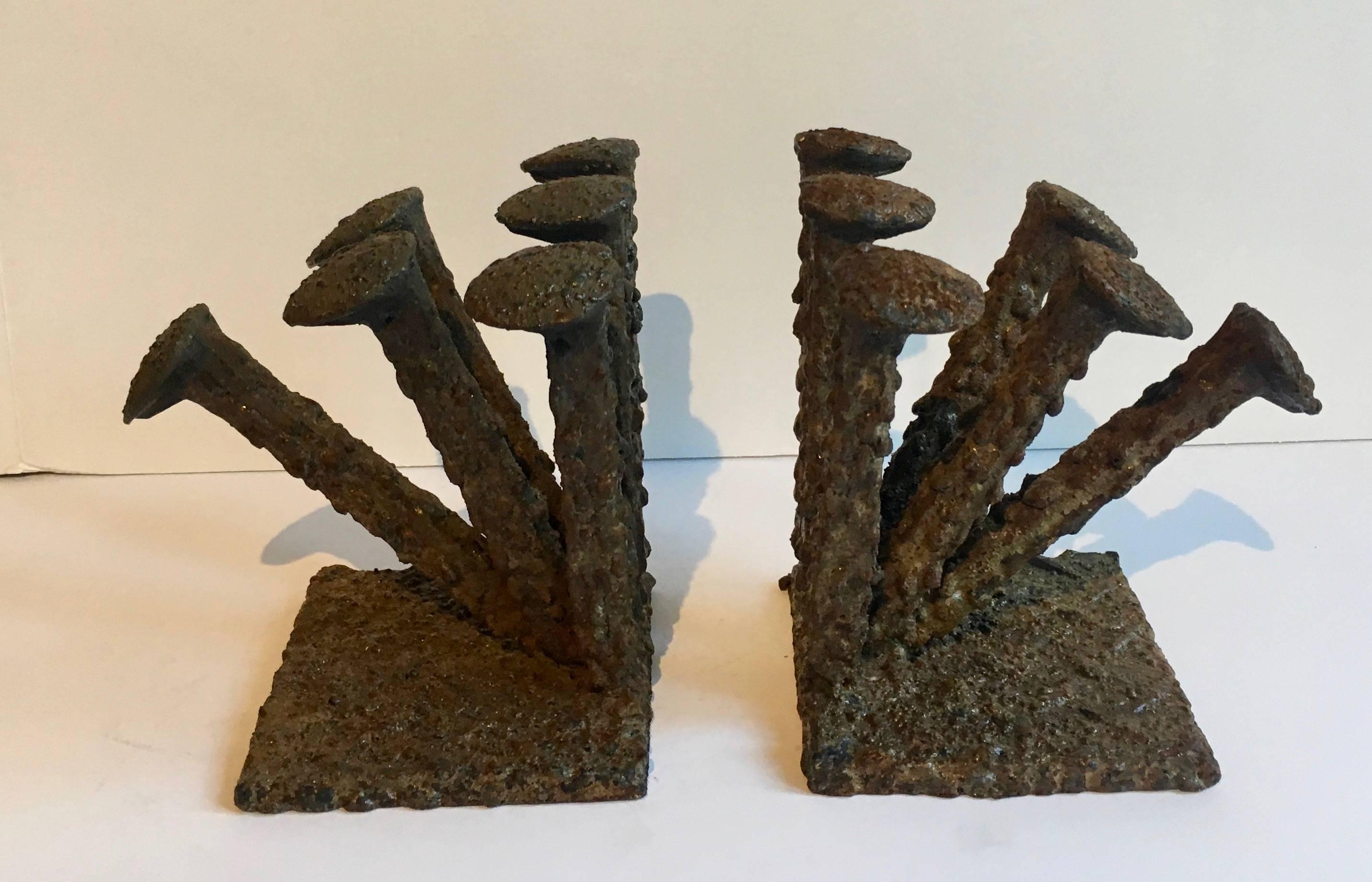 Folk Art Brutalist bookends - a fantastic example of Brutalist style. The bookends can be turned two different ways and still grab your attention. Very unique and heavy, the pair can hold books of size and weight.