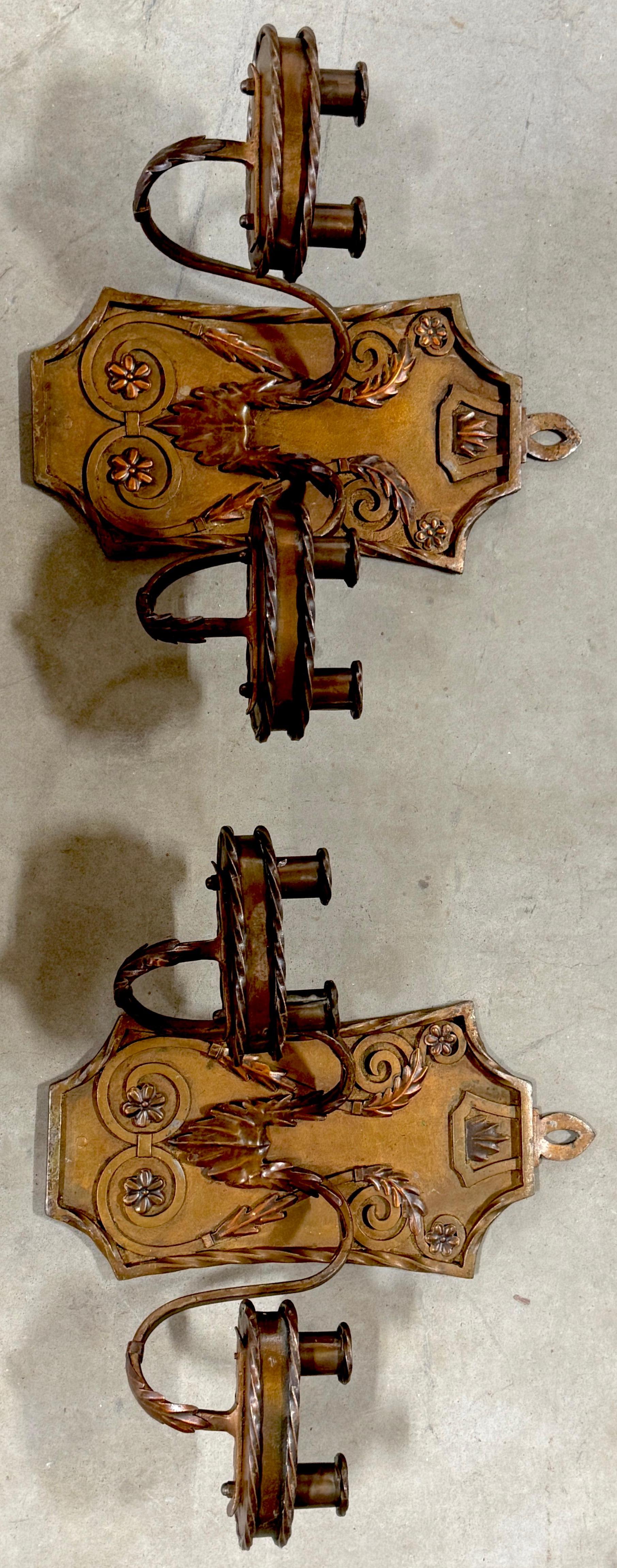 Pair of Folk Art Engraved & Applied Style Four Light Copper Candle Sconces 

This pair of early 20th-century Western Folk Art engraved and applied-style four-light copper candle sconces showcases exceptional hand-forged craftsmanship with intricate